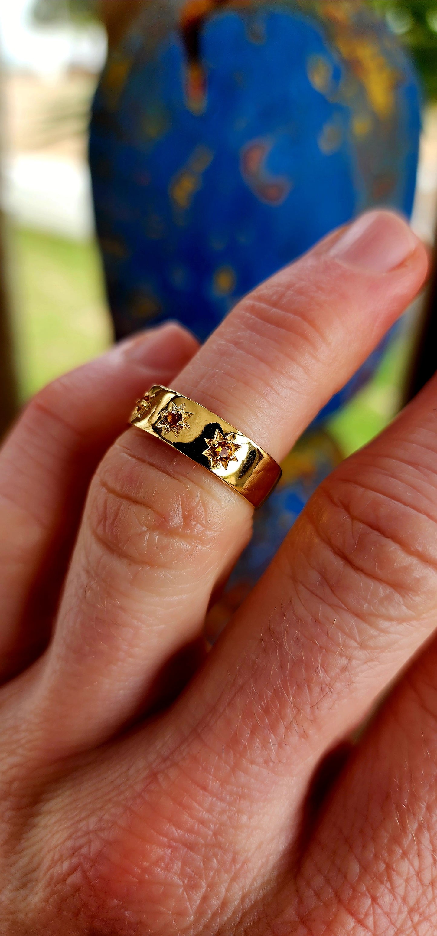 A Golden Gypsy Ring with Citrine Stardust.
Bold, luminous, and radiating warmth, this unisex gypsy ring is crafted from solid sterling silver and richly plated with glowing 18ct yellow gold.