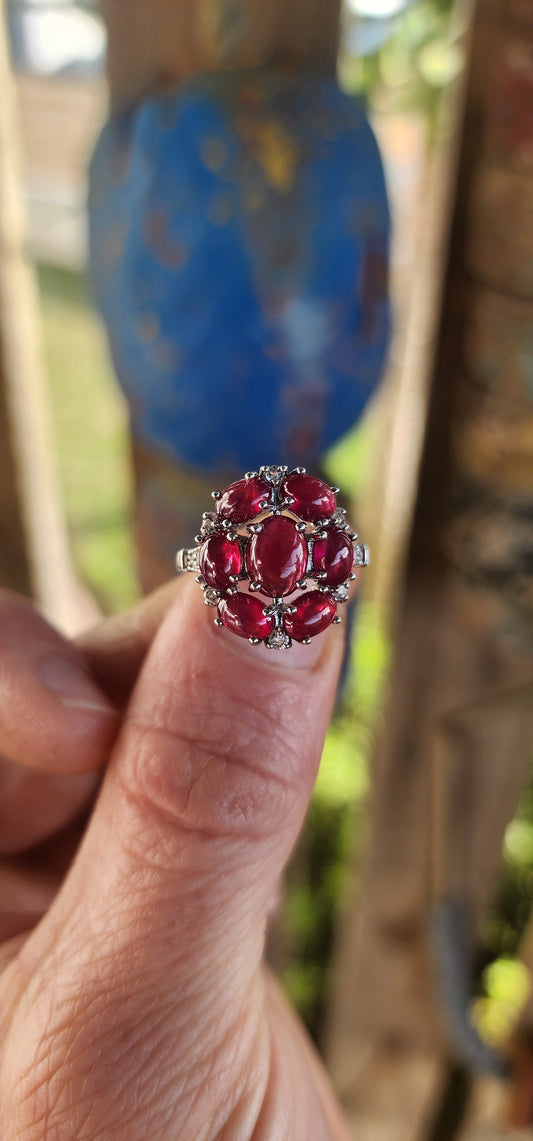 Crimson Constellation" Statement Ring.
Drenched in vivid glamour, this breathtaking sterling silver cluster ring is a celebration of deep red beauty.