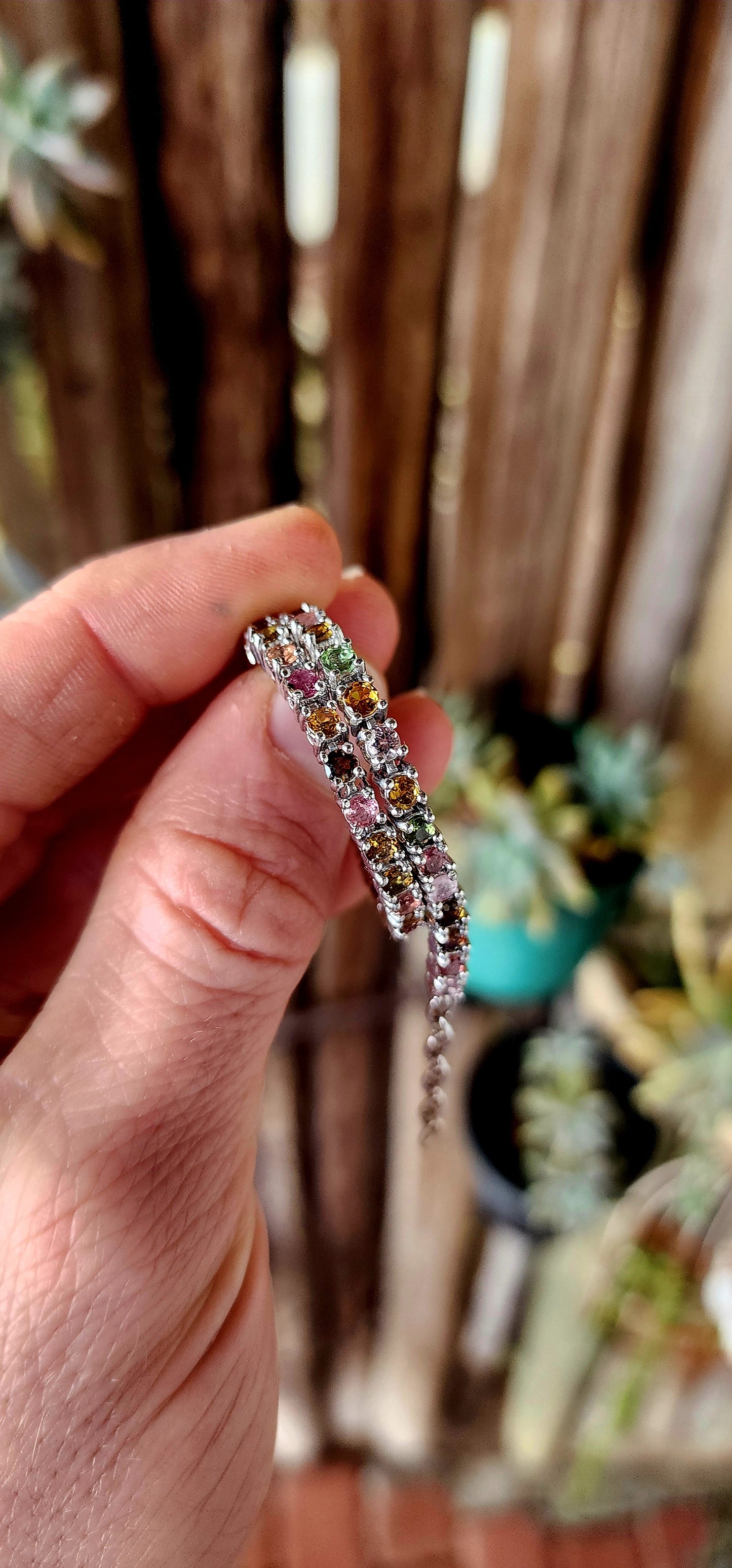 Meet the bracelet that refuses to pick a favorite color! This sleek sterling silver tennis-style beauty lines up 43 round-cut tourmaline gemstones in a dazzling spectrum—from leafy greens and golden ambers to bubblegum pinks and raspberry reds.