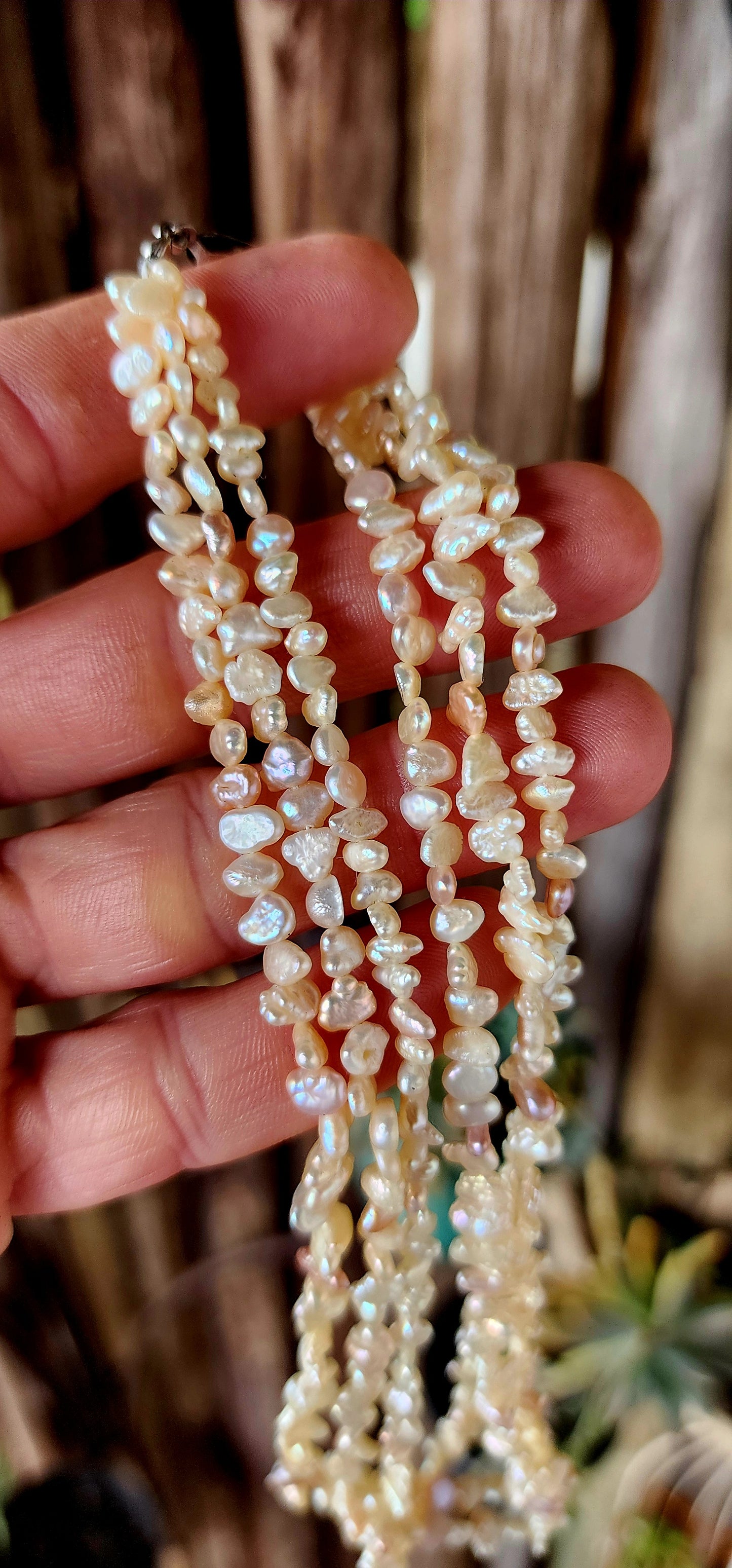 This beautiful vintage art deco era necklace showcases three strands of luminous freshwater keshi rice pearls, each with its own unique, organic shape.
