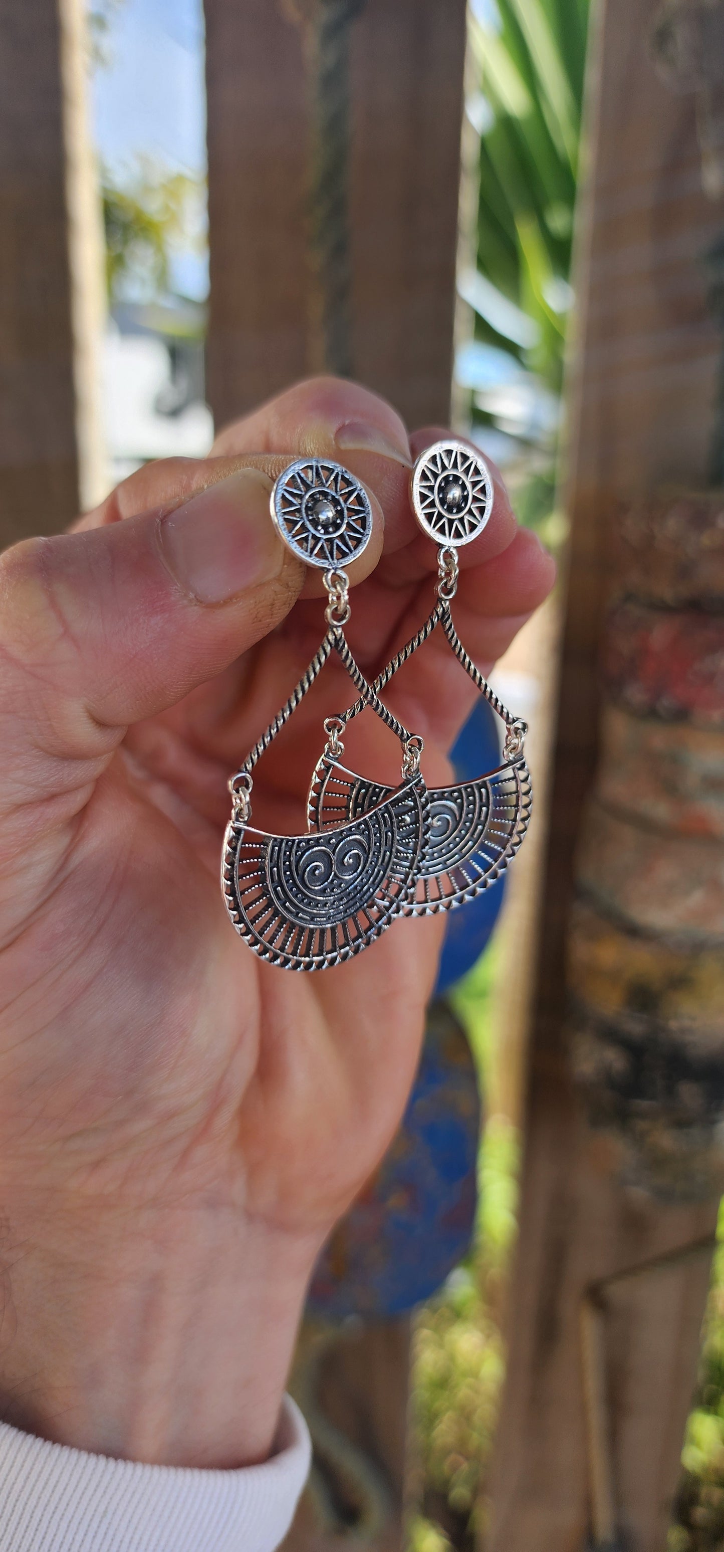 These striking earrings are crafted in solid sterling silver, showcasing a bold bohemian–tribal aesthetic that’s both artistic and wearable.