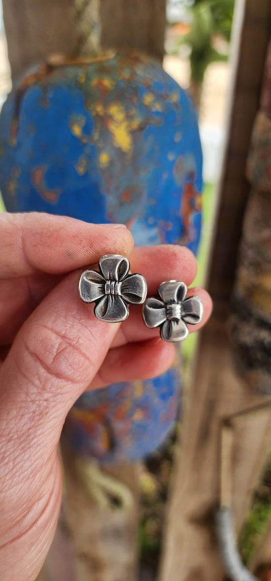 This vintage pair of clip-on earrings, crafted circa 1957, is a charming showcase of Scandinavian design elegance.