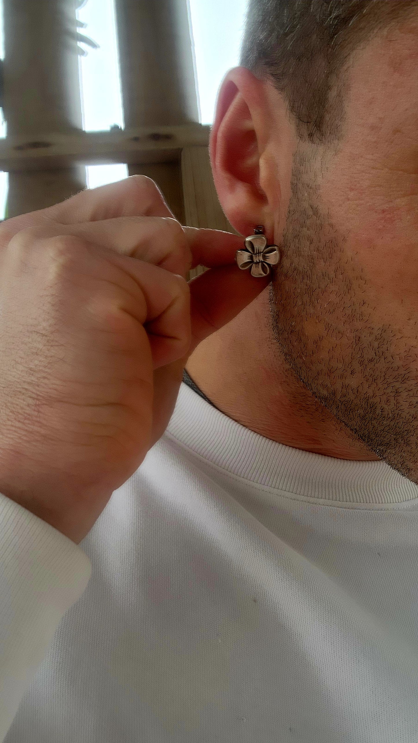 This vintage pair of clip-on earrings, crafted circa 1957, is a charming showcase of Scandinavian design elegance.