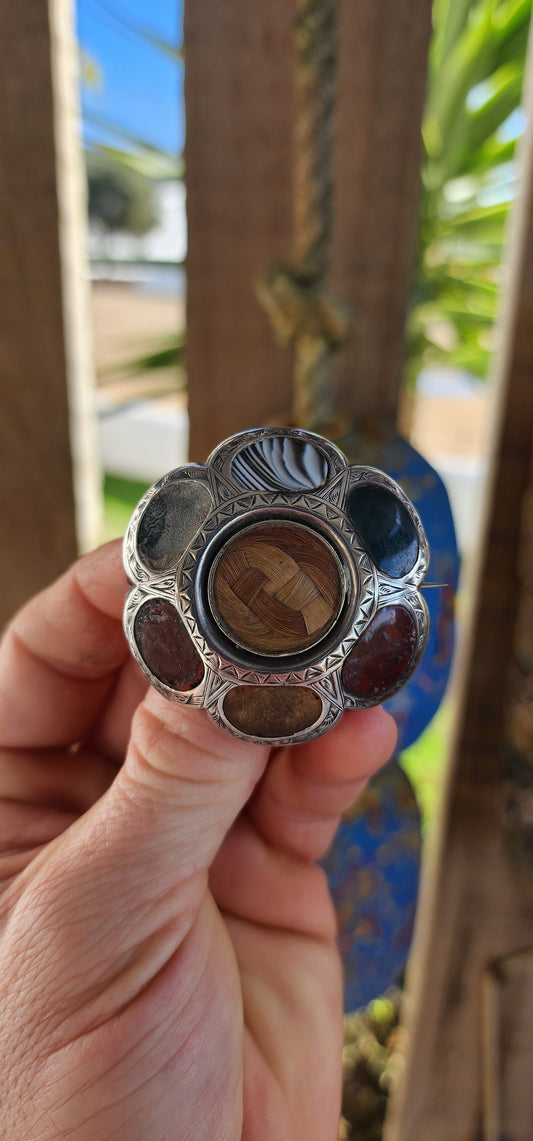 A truly exceptional find, this generous-sized Victorian-era sterling silver Scottish mourning brooch/pendant carries with it layers of history, symbolism, and sentiment.