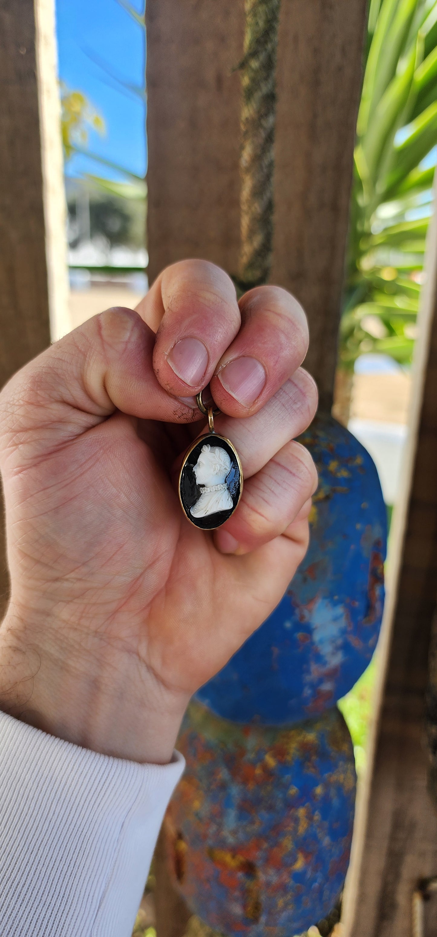 This is an antique Victorian-era cameo pendant, dating from the mid-to-late 19th century, crafted in the popular Neoclassical Revival style that dominated jewelry of the time.