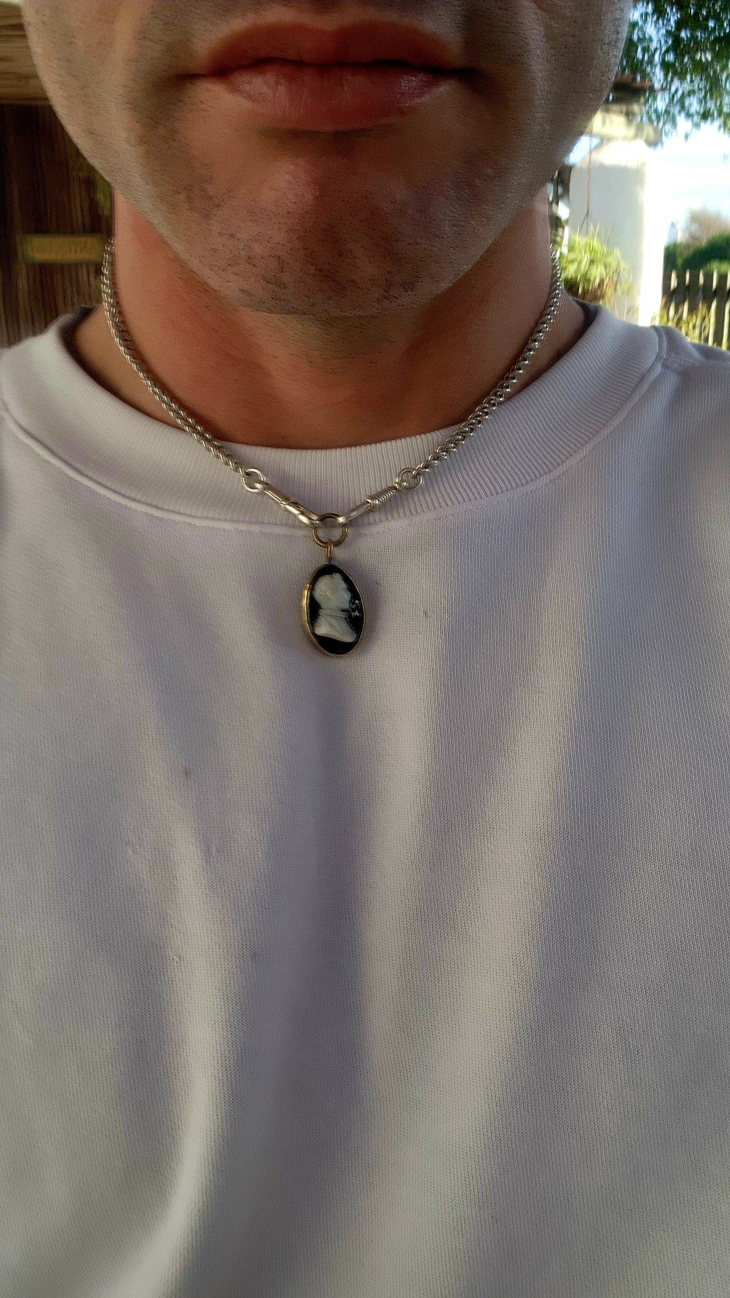 This is an antique Victorian-era cameo pendant, dating from the mid-to-late 19th century, crafted in the popular Neoclassical Revival style that dominated jewelry of the time.