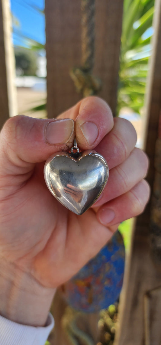 Go bold with this oversized vintage hollow sterling silver puffed heart pendant – a timeless classic with just the right amount of retro charm.