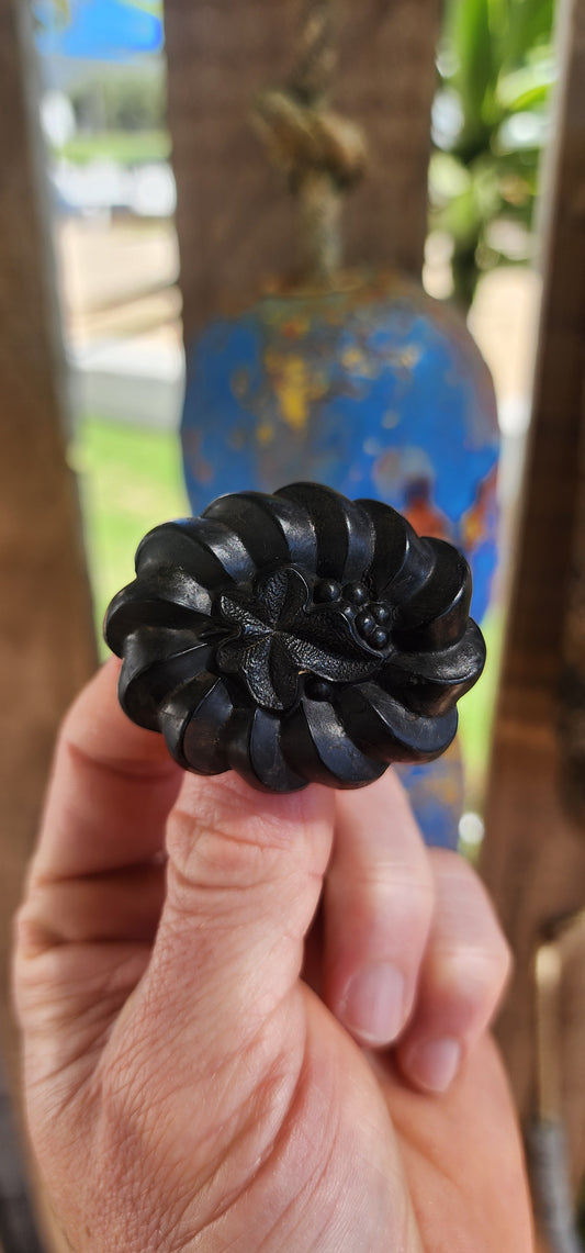 This is a rare antique Victorian mourning brooch, hand-carved from Irish bog oak, dating to the late 19th century, circa 1880s.