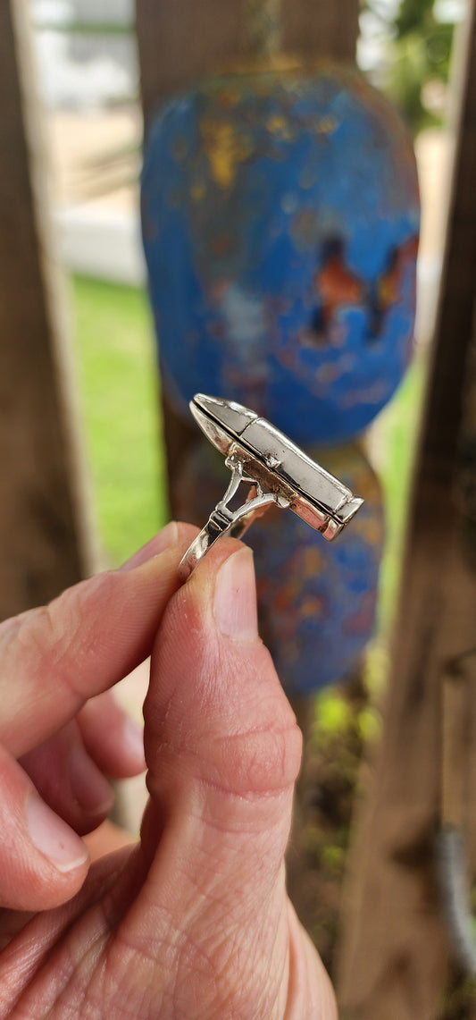 This is a vintage sterling silver unisex novelty poison/locket ring crafted in the exact form of a realistic bullet. Bold, rebellious, and full of intrigue, the piece doubles as both adornment and secret keeper.