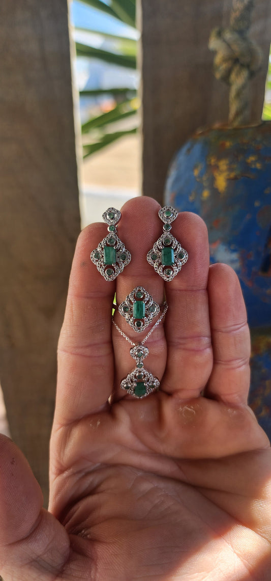 Magical and enchanting — this matching sterling silver ring, earrings, and pendant suite brings vintage glamour back to life!