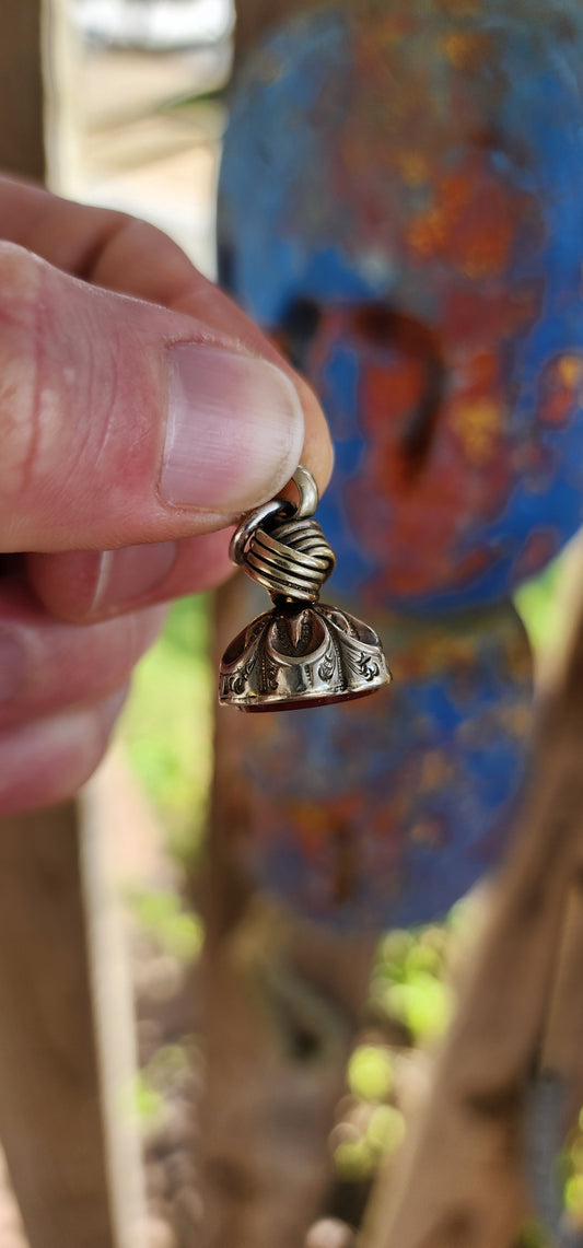 Antique Victorian era silver-plated fob seal pendant.
Exquisitely crafted, the top features an intricate knot design — often interpreted as a symbol of unity, continuity, and eternal bonds.