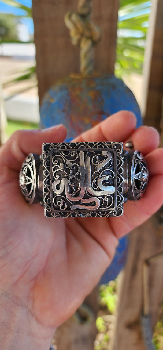 Striking antique hinged bangle, crafted in solid 800 silver with commanding presence and intricate artistry.