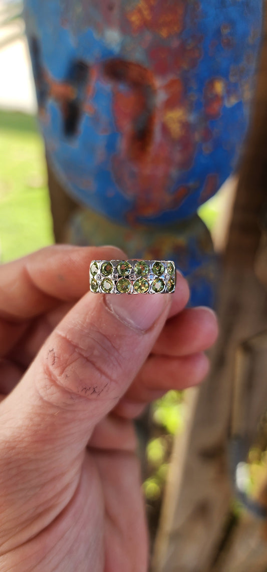 This chunky unisex half-eternity style ring is crafted in sterling silver and finished with a protective layer of rhodium plating for a bright, tarnish-resistant sparkle.