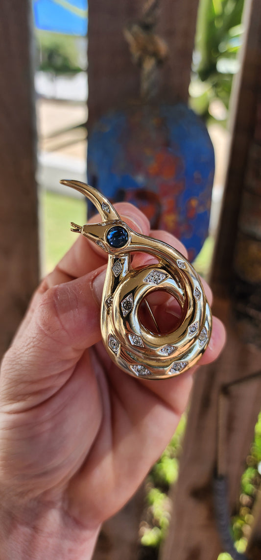 A dramatic and larger-sized vintage 1970s costume brooch crafted in the striking form of a coiled serpent.