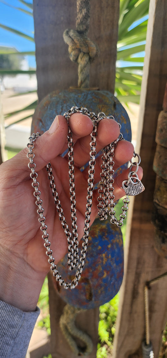 Up for grabs is this extra-length silver-plated rolo link necklace, an early creation by the renowned local designer Armilla.