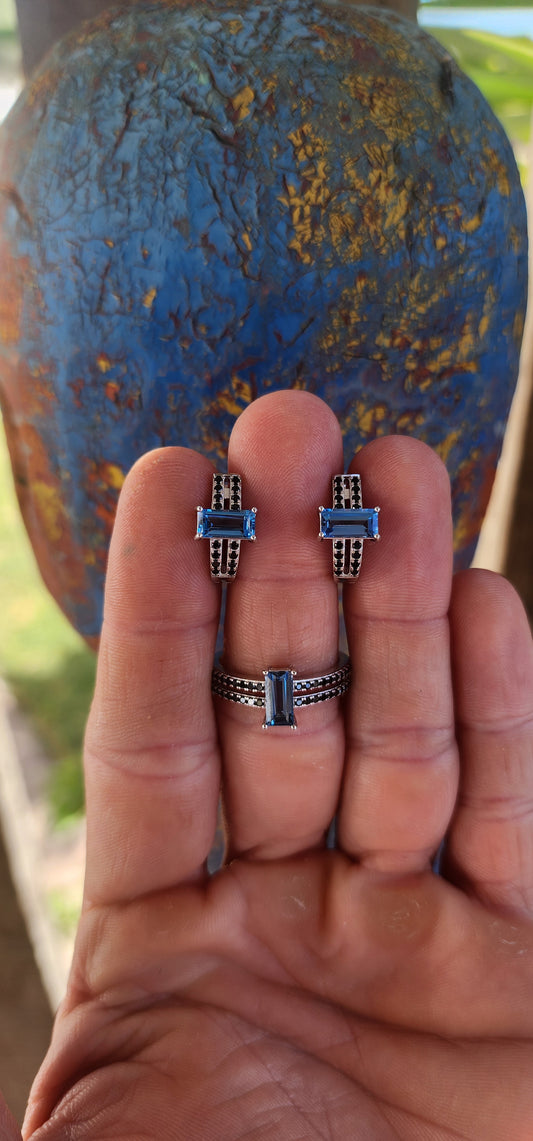 Swiss Blue Elegance – Sterling Silver & Spinel Set.
This striking matching set, consisting of a dress ring and coordinating earrings, is a perfect blend of bold color and design.