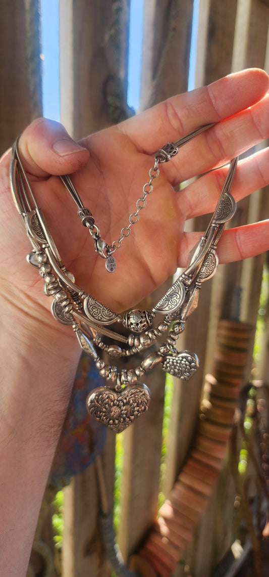 This chunky designer multi-strand heart necklace by Gas Bijoux is a bold and romantic statement piece that perfectly embodies the brand’s signature blend of bohemian luxury and Parisian sophistication.