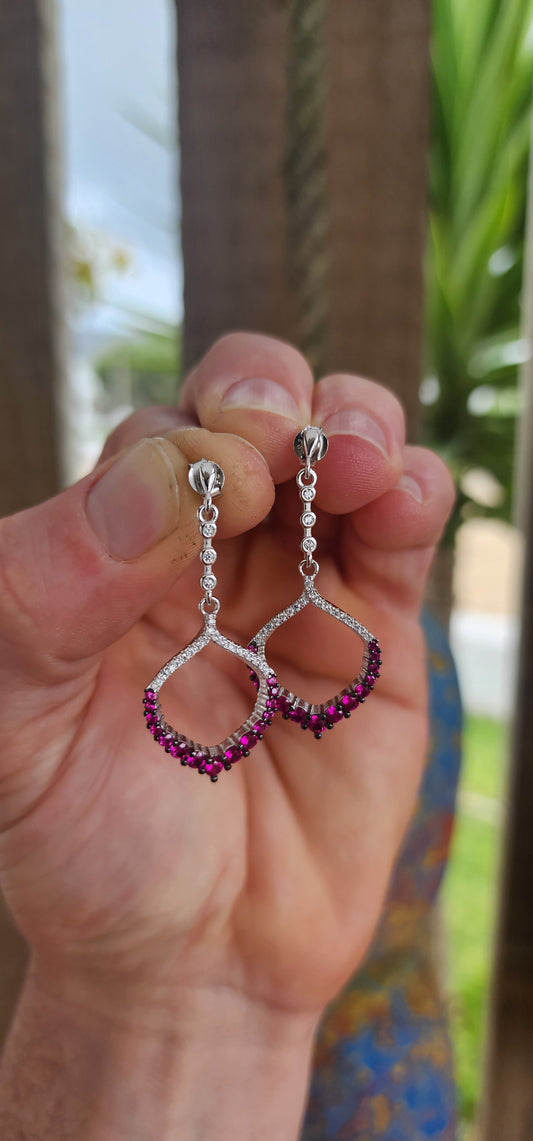 These dazzling drop earrings are where playful charm meets red carpet elegance.