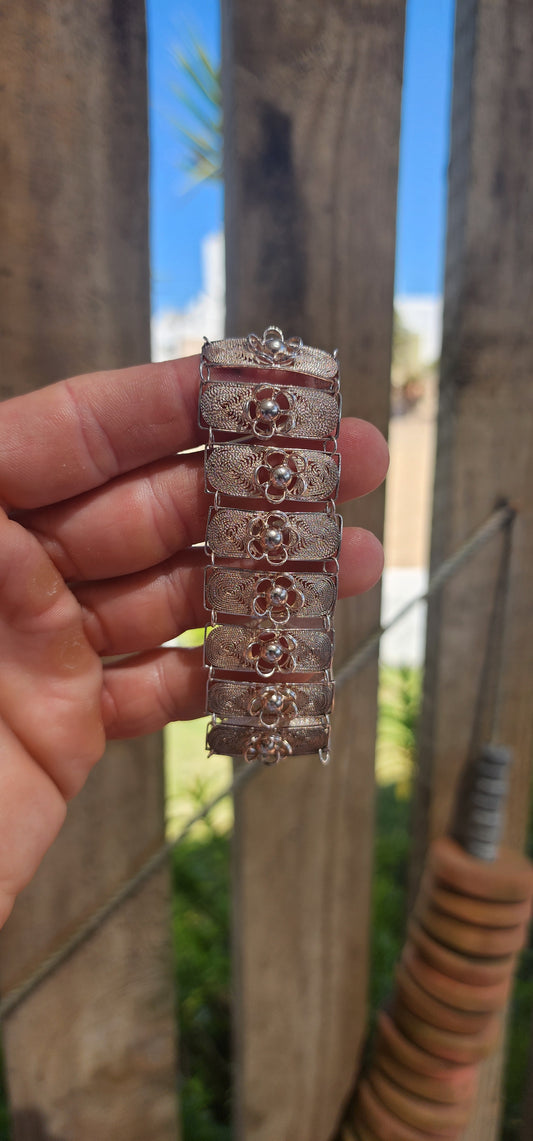 A beautiful and substantial vintage sterling silver filigree panel bracelet, handcrafted with remarkable artistry and traditional skill.