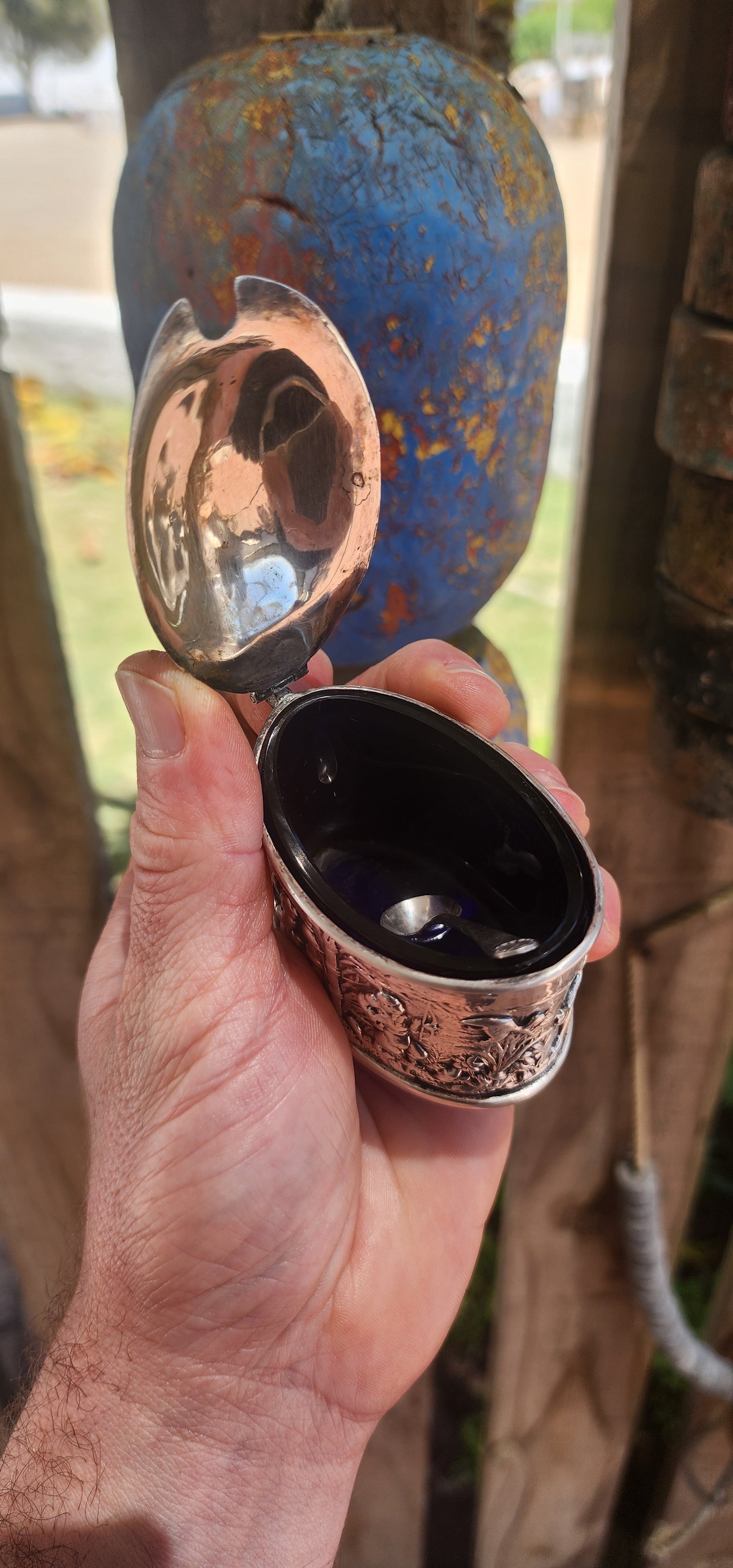 A beautiful example of Edwardian fascination with the “mystique of the East,” this circa 1902 hallmarked sterling silver mustard pot is richly cast in high relief with scenes of traditional life.