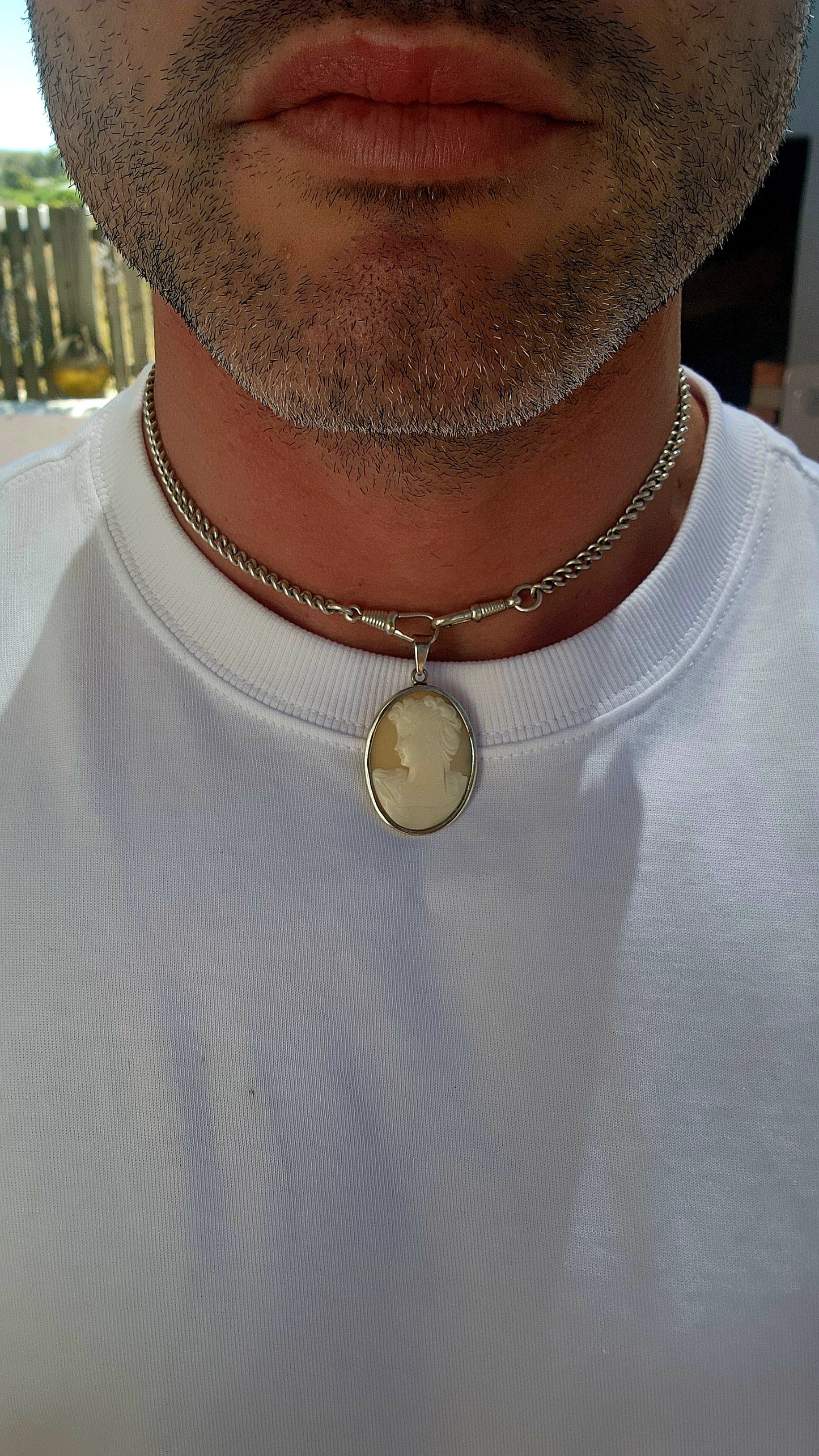 Beautifull and generous in size vintage shell cameo pendant, lovingly set in a sleek sterling silver tube-style frame.