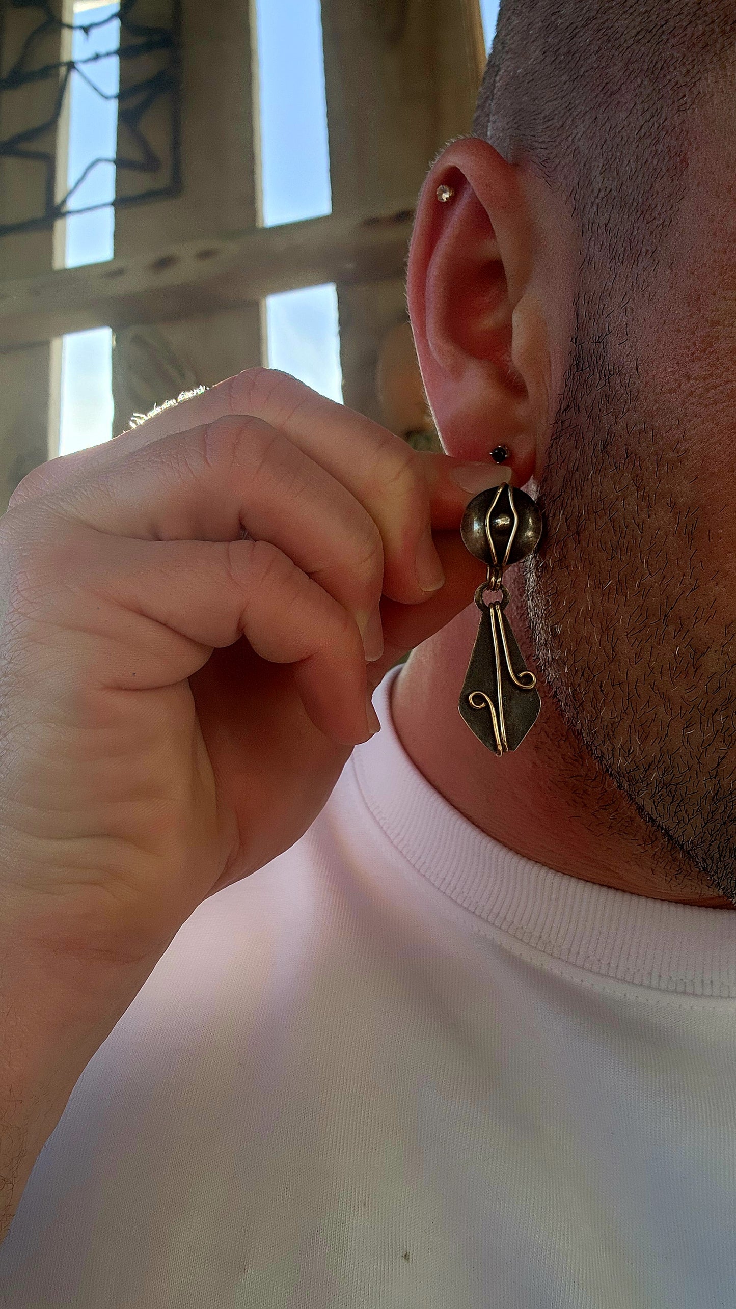 A spectacular Arts & Crafts era treasure (c. 1900s) — this generous, hand-wrought pair of clip-on drop earrings perfectly captures the raw spirit and bold design language of early artisan metalwork.
