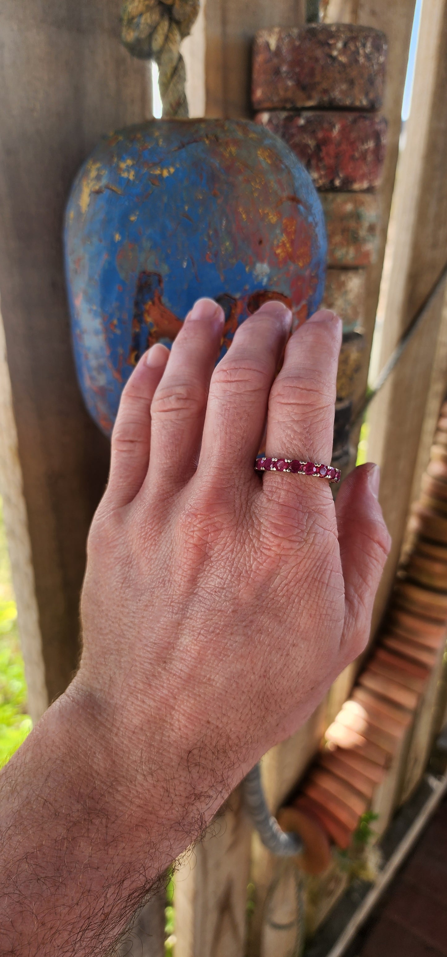 This sterling silver full eternity ring is a true showstopper—crafted with precision and designed to dazzle from every angle. A continuous circle of rich, round-cut rubies is prong-set all the way around.