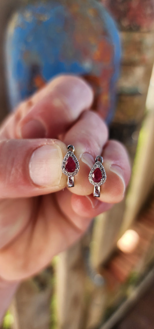 Delicately crafted in glowing sterling silver, these earrings embody sophistication in a compact yet captivating design.