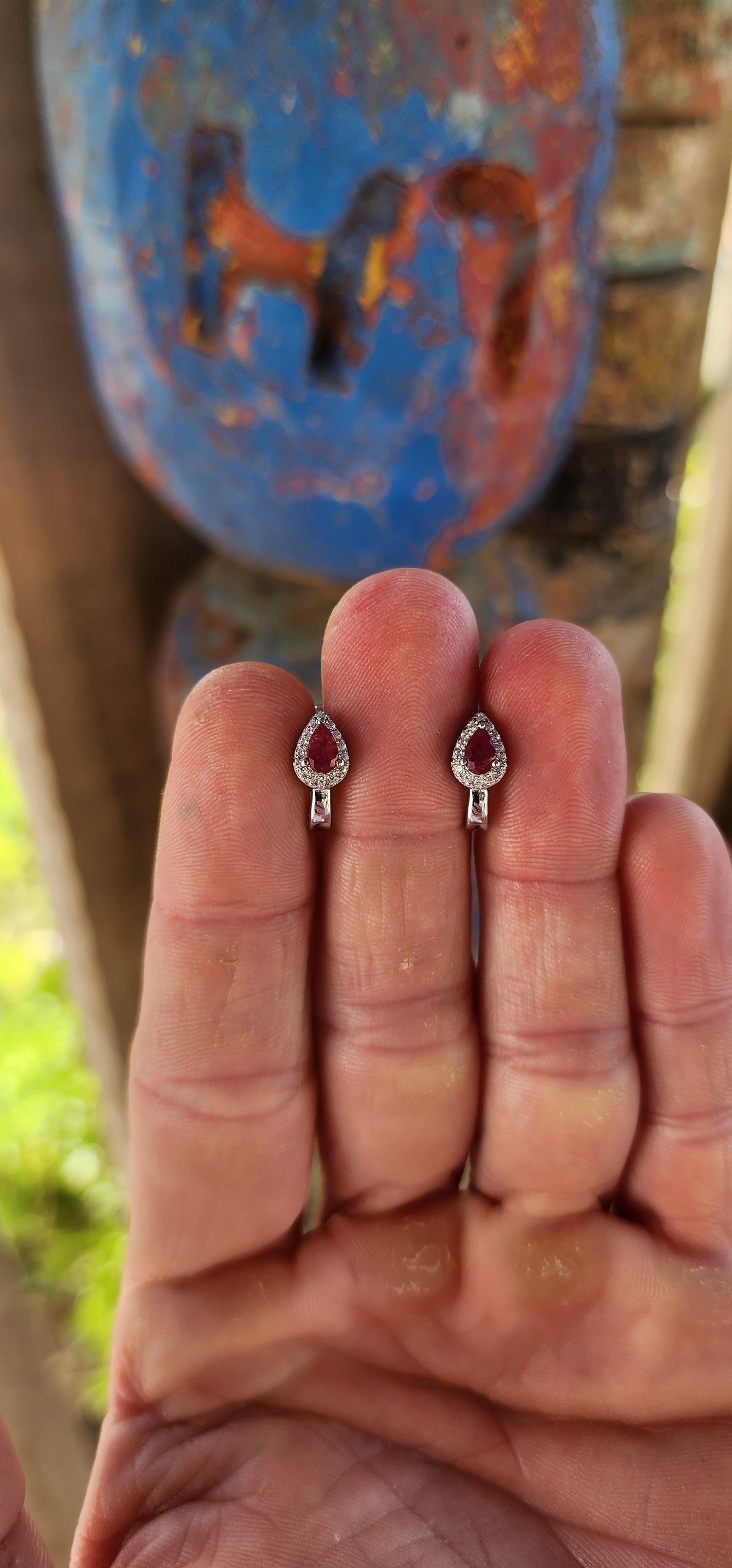 Delicately crafted in glowing sterling silver, these earrings embody sophistication in a compact yet captivating design.