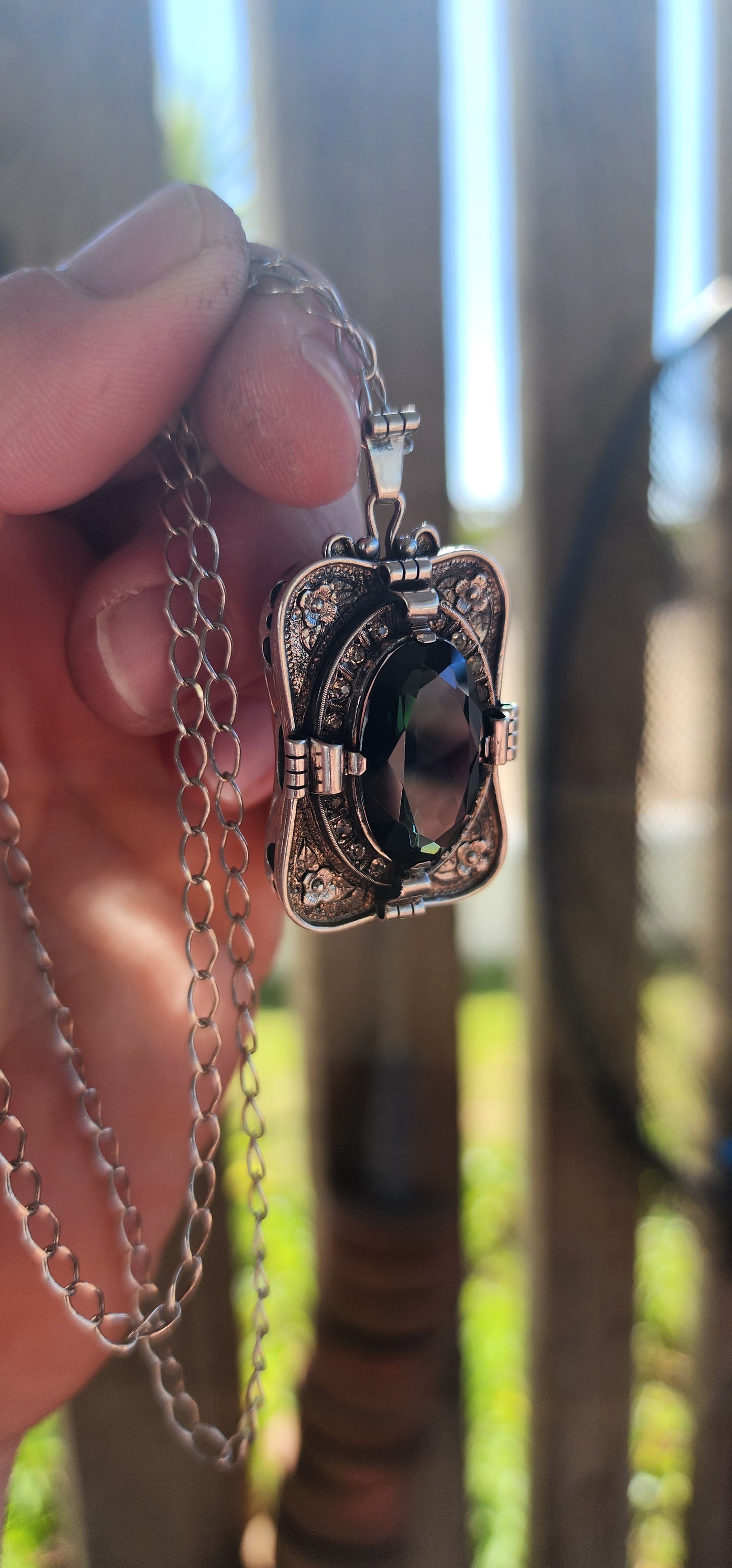 A magnificent step-back into the golden age of glamour, this rare and generous Art Deco pendant is a true showpiece—richly detailed, architecturally sculpted, and brimming with Old-World mystique.