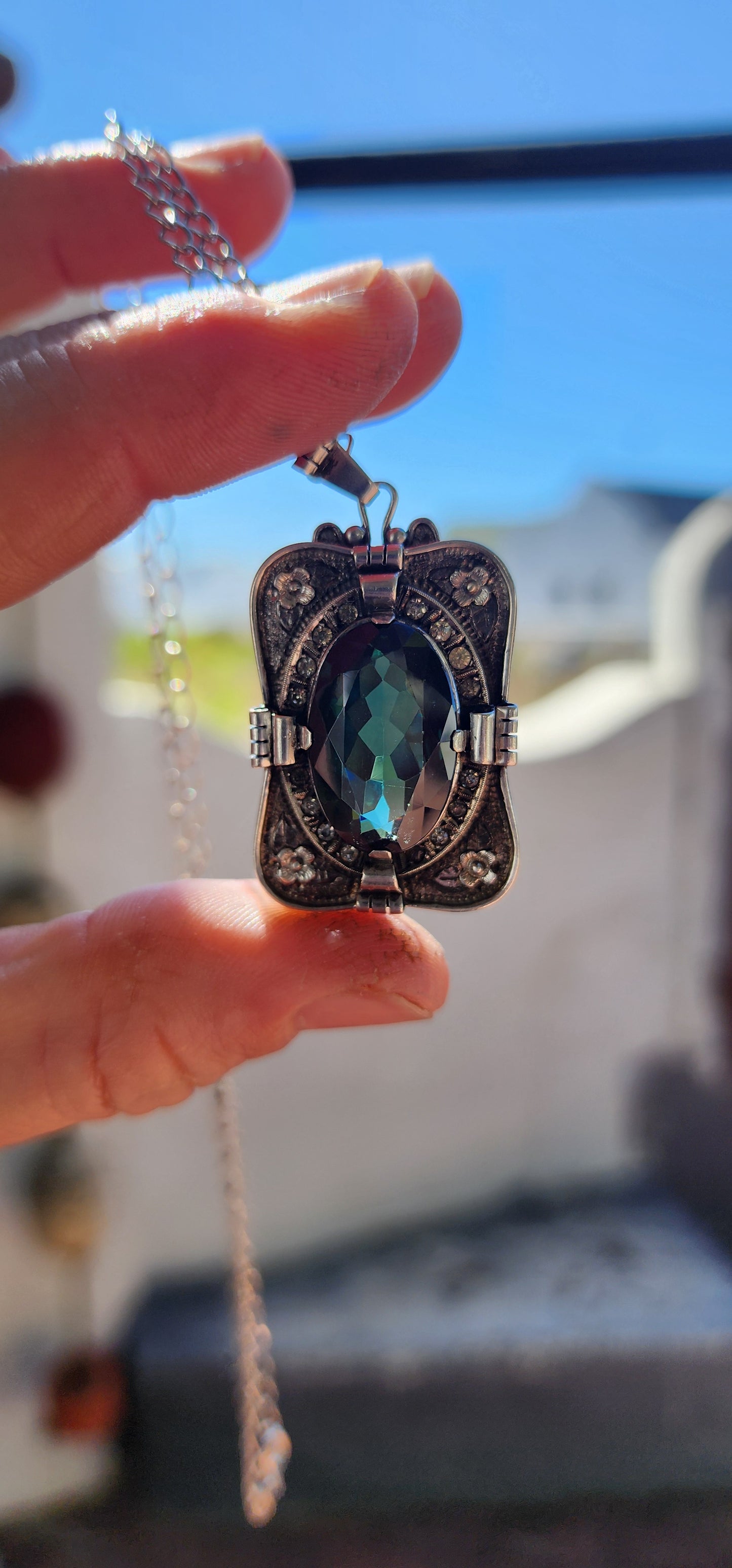 A magnificent step-back into the golden age of glamour, this rare and generous Art Deco pendant is a true showpiece—richly detailed, architecturally sculpted, and brimming with Old-World mystique.