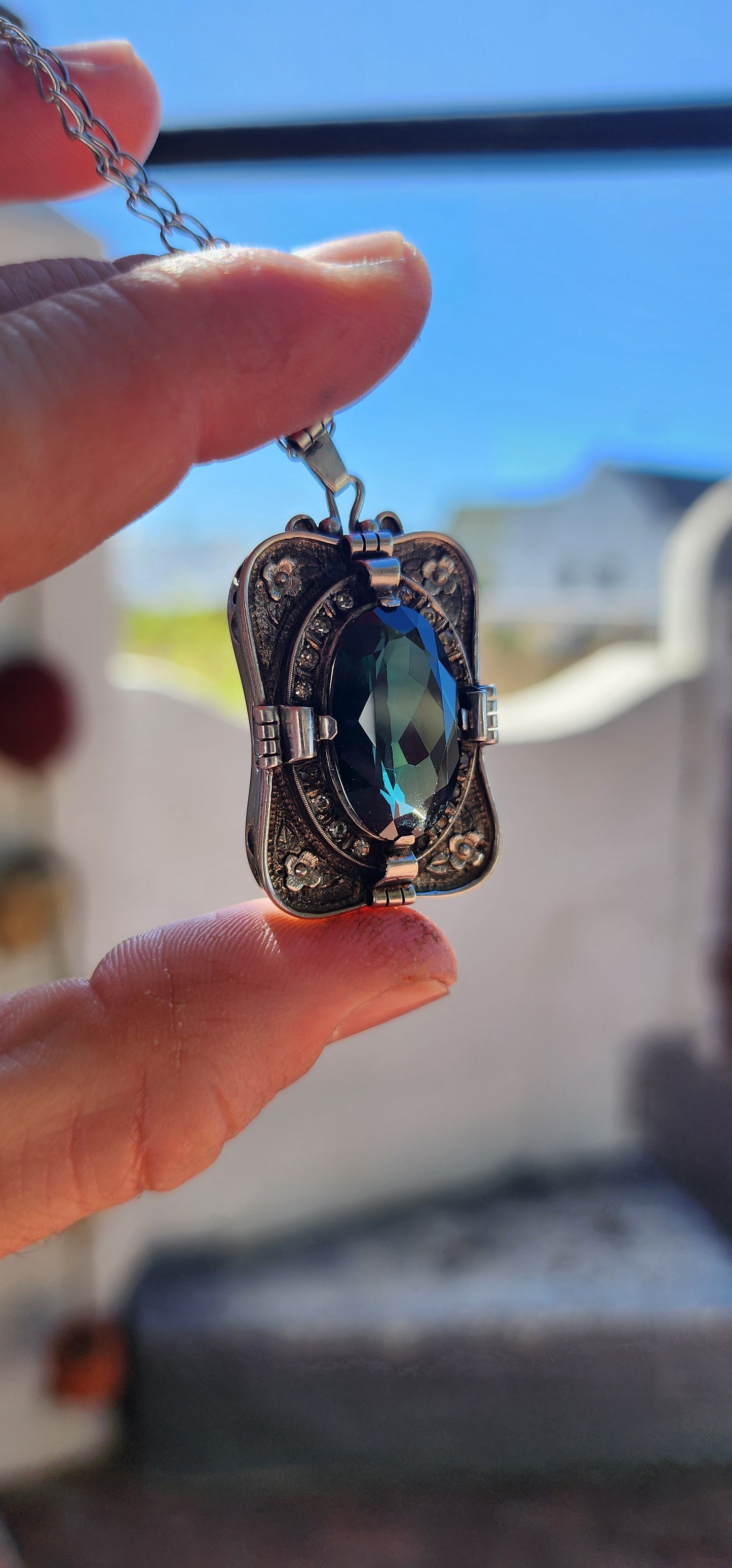 A magnificent step-back into the golden age of glamour, this rare and generous Art Deco pendant is a true showpiece—richly detailed, architecturally sculpted, and brimming with Old-World mystique.