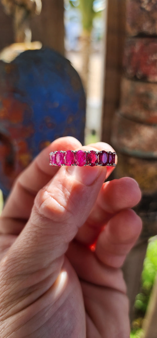 This mesmerising full-eternity beauty is a never-ending ribbon of romance, showcasing 18 glowing oval-cut rubies in a seamless band of fire and colour.