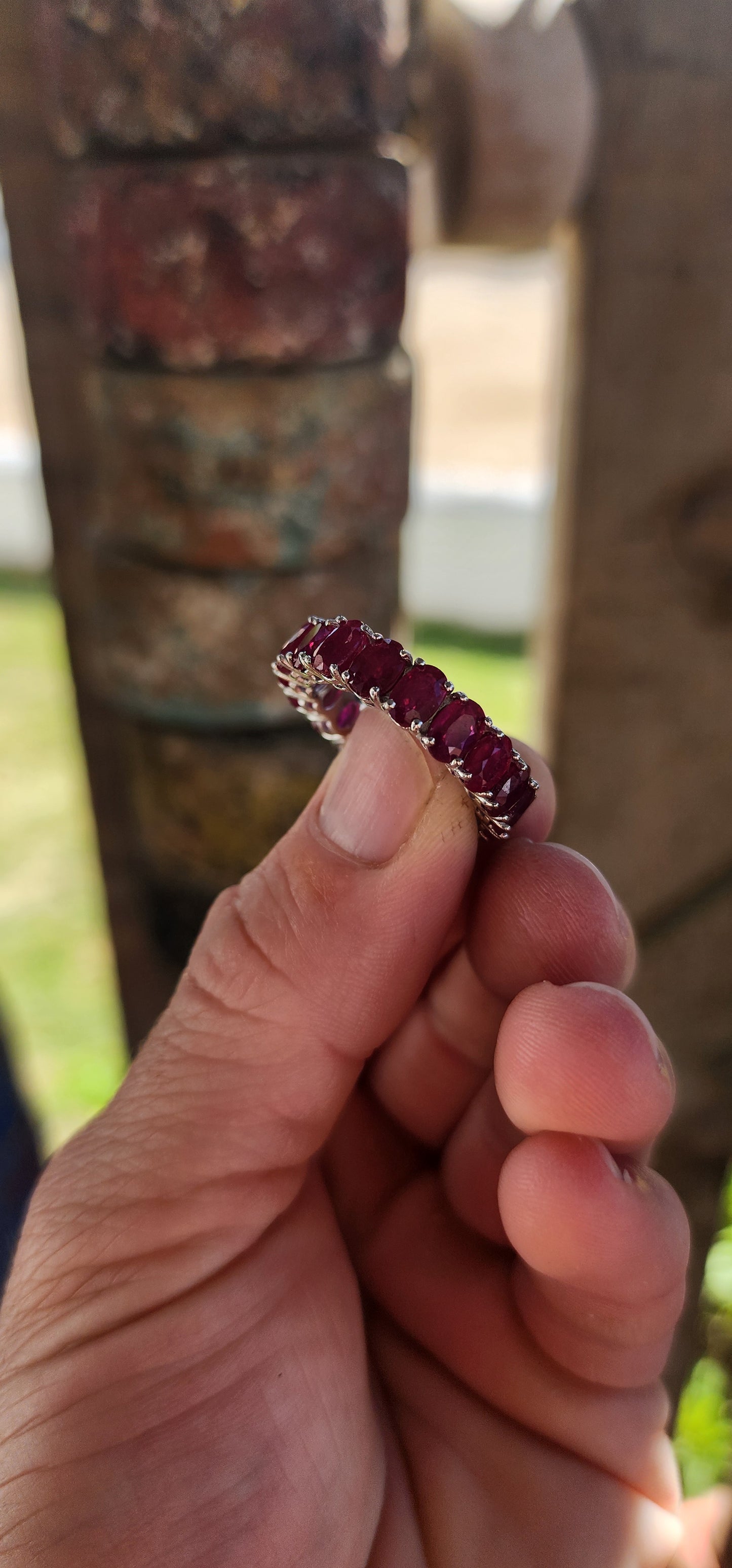 This mesmerising full-eternity beauty is a never-ending ribbon of romance, showcasing 18 glowing oval-cut rubies in a seamless band of fire and colour.