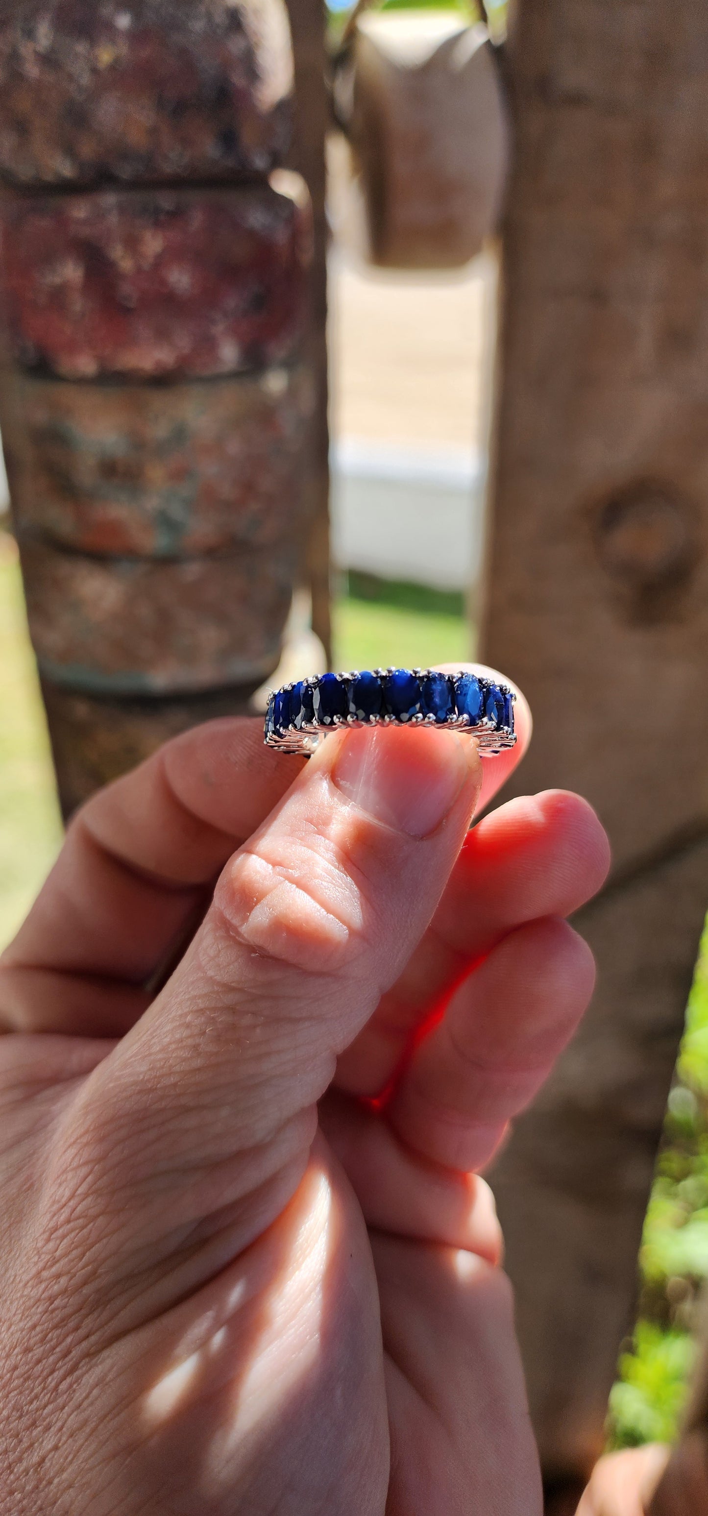 This breathtaking full-eternity ring is a deep-blue dream, set with 21 richly saturated oval-cut sapphires arranged in an unbroken circle of twilight brilliance.
