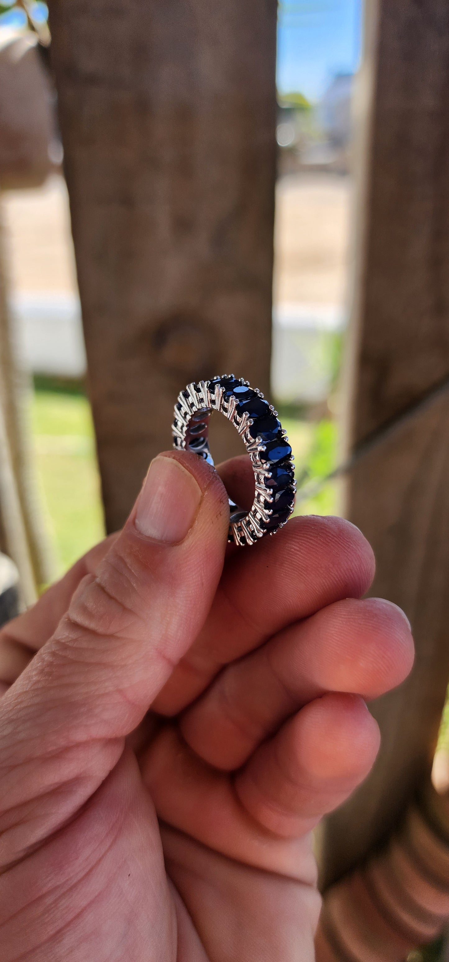 This breathtaking full-eternity ring is a deep-blue dream, set with 21 richly saturated oval-cut sapphires arranged in an unbroken circle of twilight brilliance.