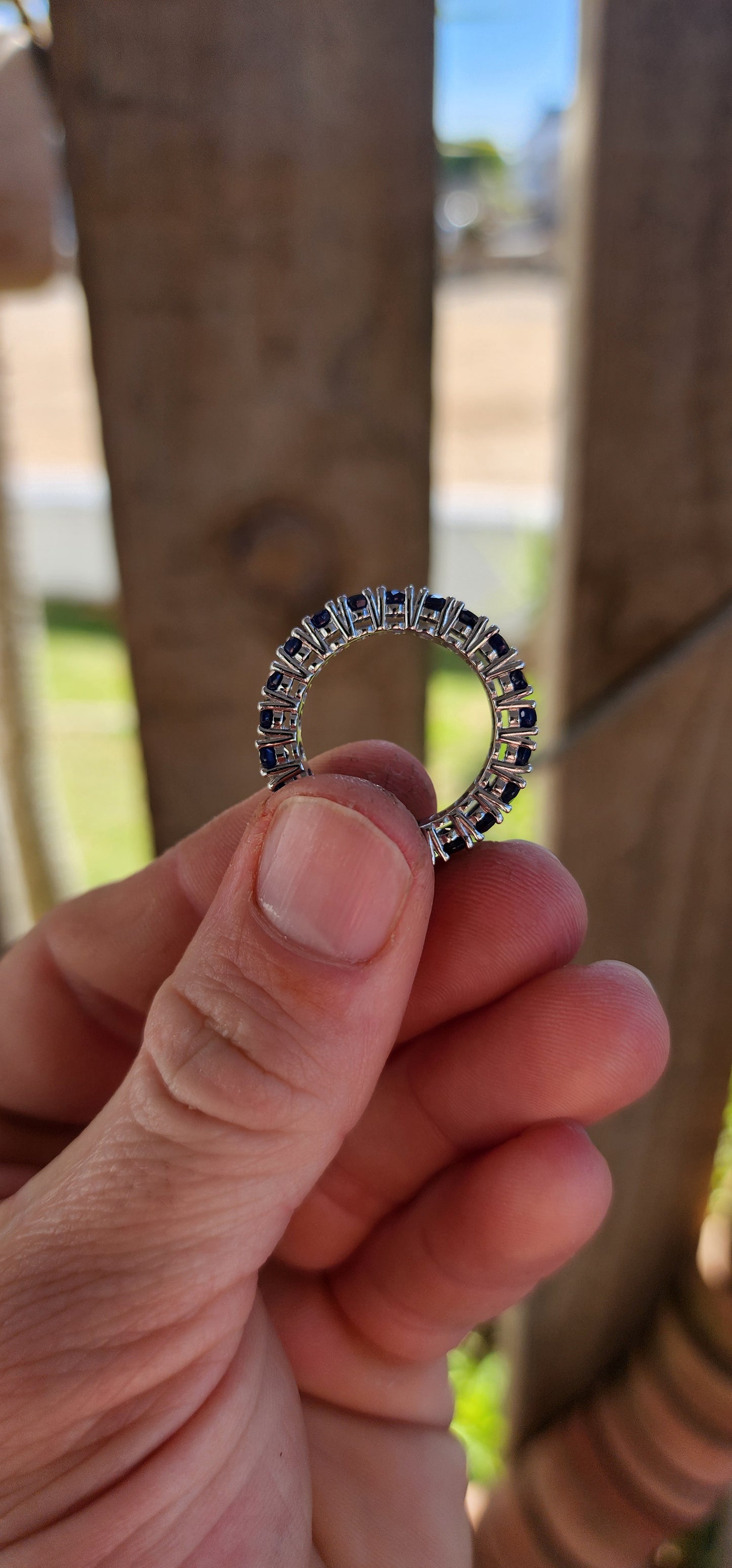 This breathtaking full-eternity ring is a deep-blue dream, set with 21 richly saturated oval-cut sapphires arranged in an unbroken circle of twilight brilliance.