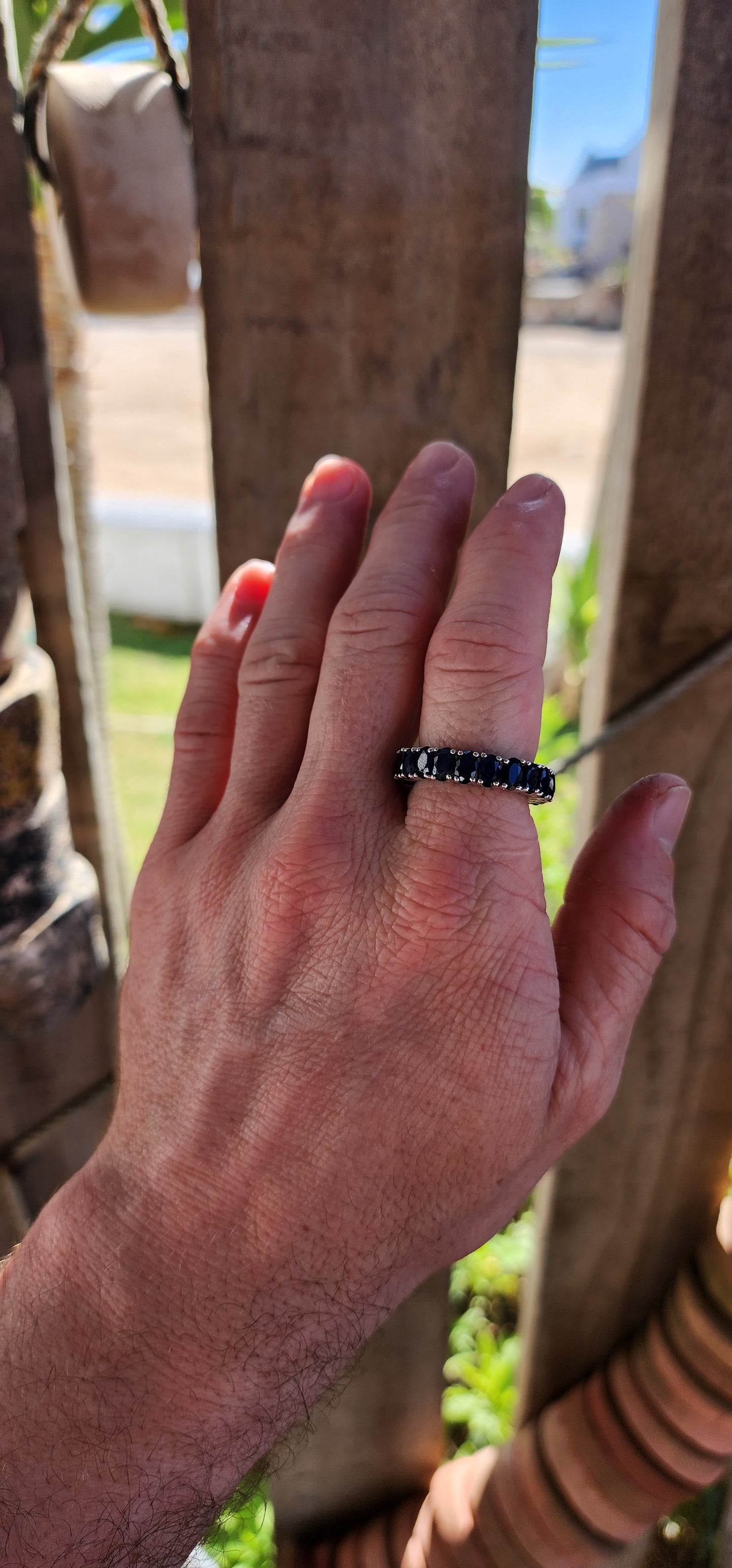 This breathtaking full-eternity ring is a deep-blue dream, set with 21 richly saturated oval-cut sapphires arranged in an unbroken circle of twilight brilliance.