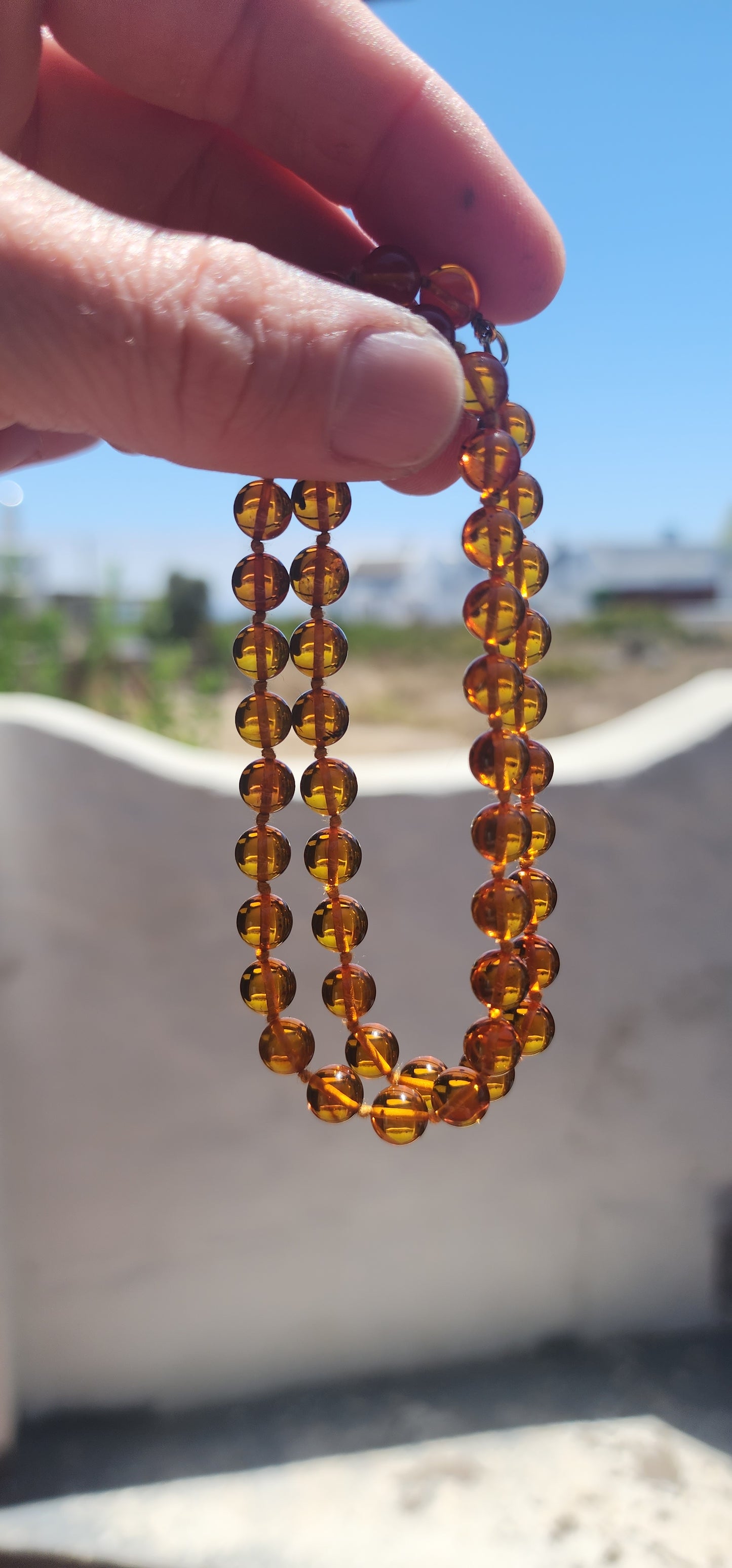 A warm sun-kissed treasure, this beautiful vintage cognac Baltic amber necklace radiates honey-rich glow and natural charm.