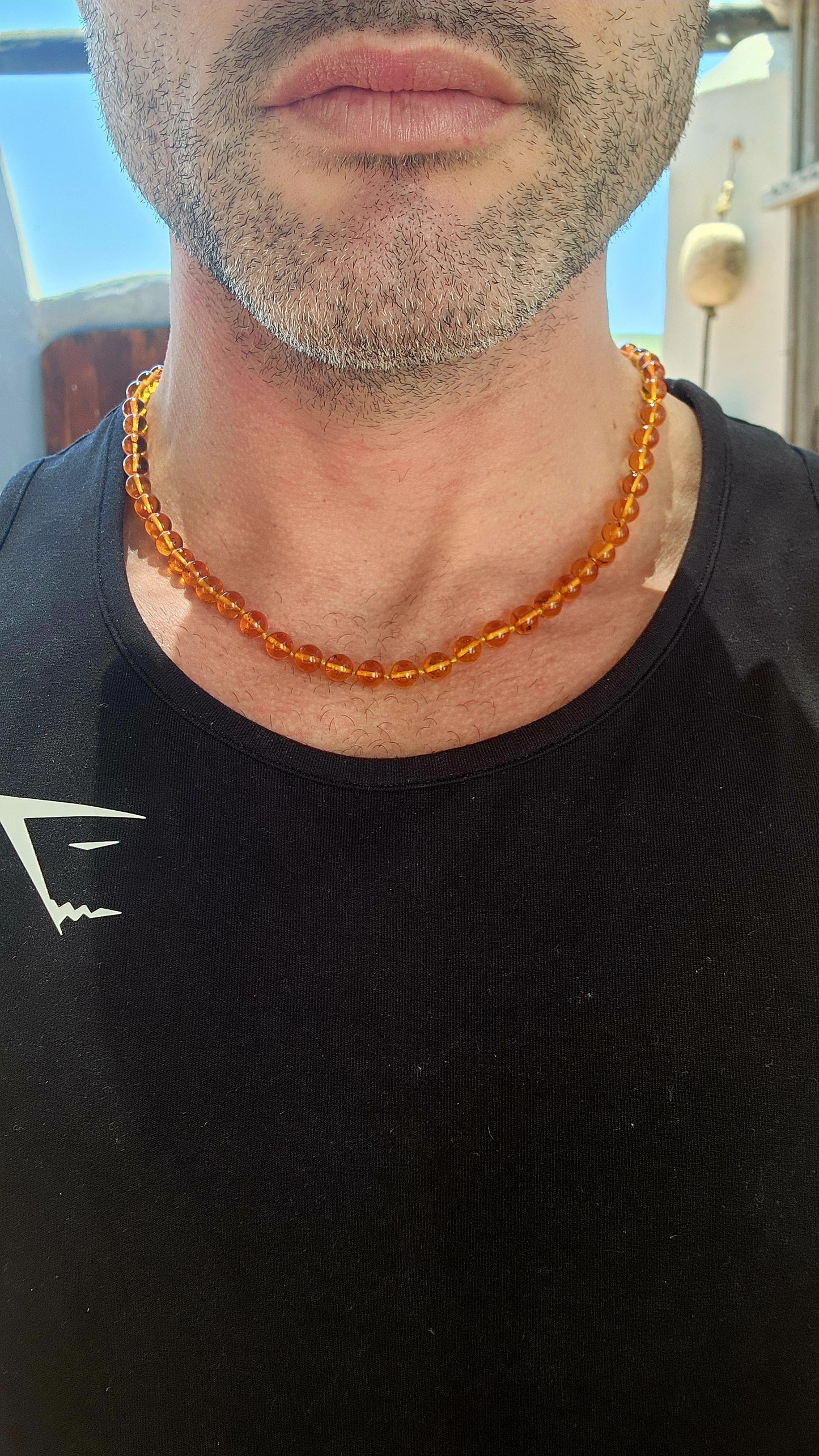 A warm sun-kissed treasure, this beautiful vintage cognac Baltic amber necklace radiates honey-rich glow and natural charm.