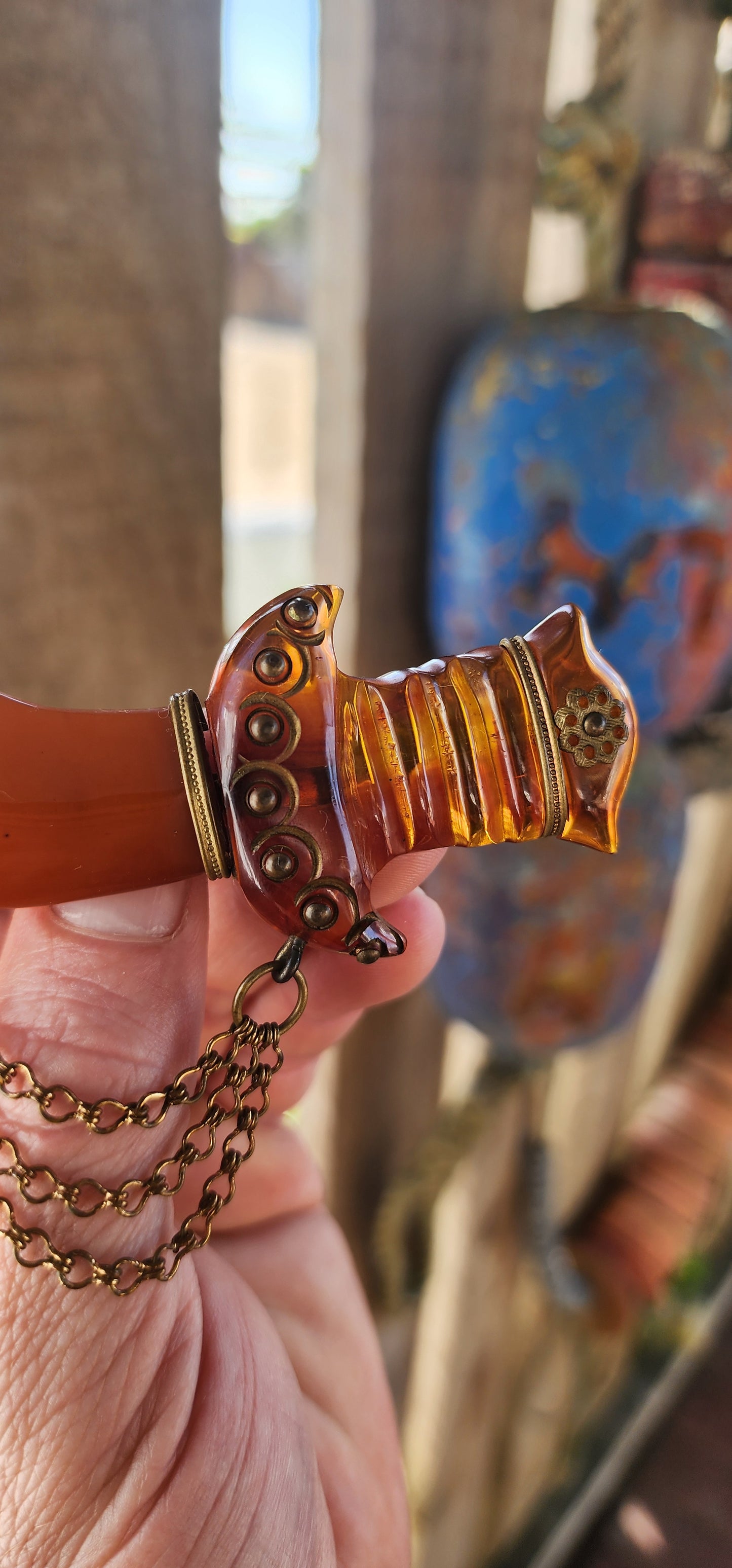 Marvelous and oversized Art Deco–era bakelite novelty brooch, exquisitely carved in the exotic form of a Persian dagger (khanjar)