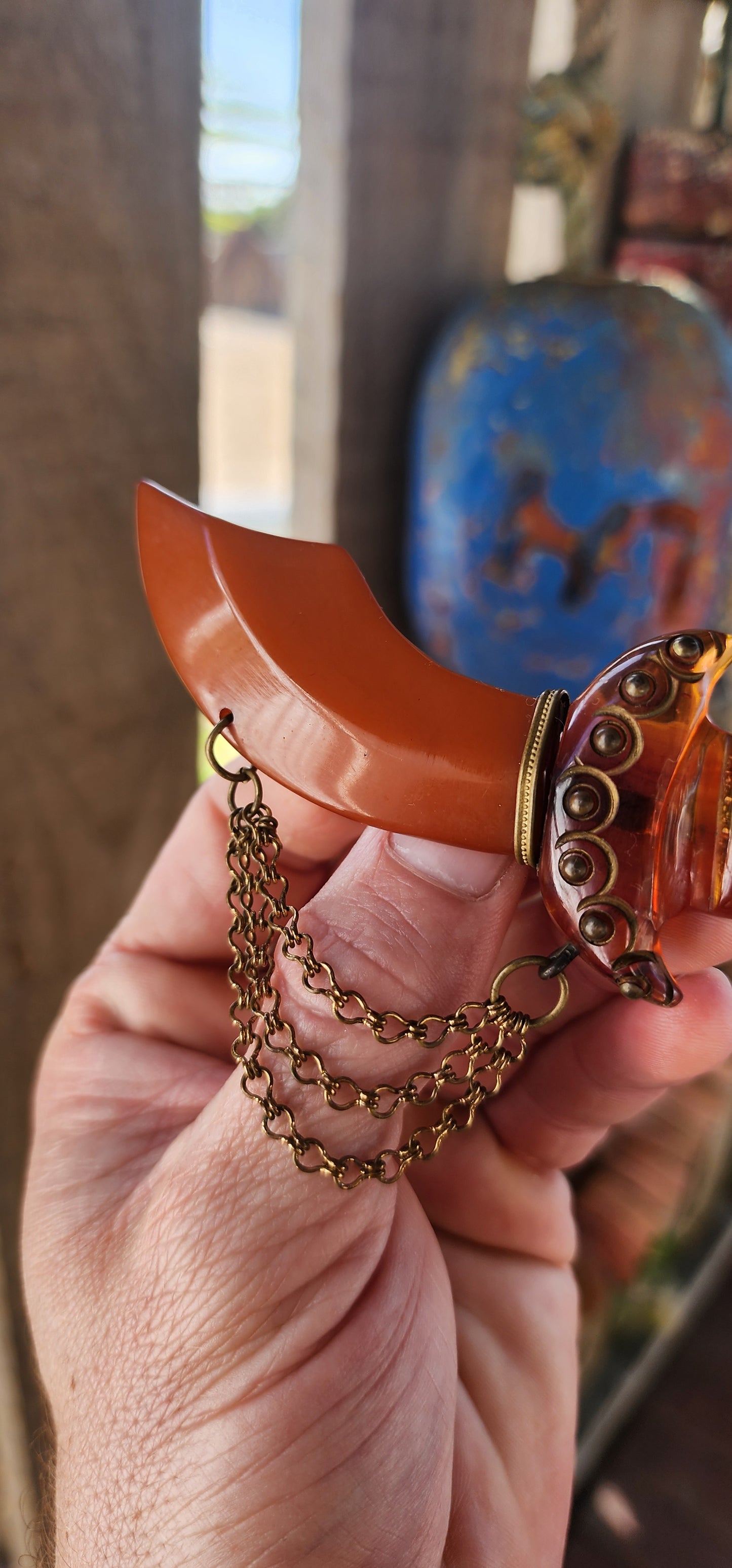 Marvelous and oversized Art Deco–era bakelite novelty brooch, exquisitely carved in the exotic form of a Persian dagger (khanjar)