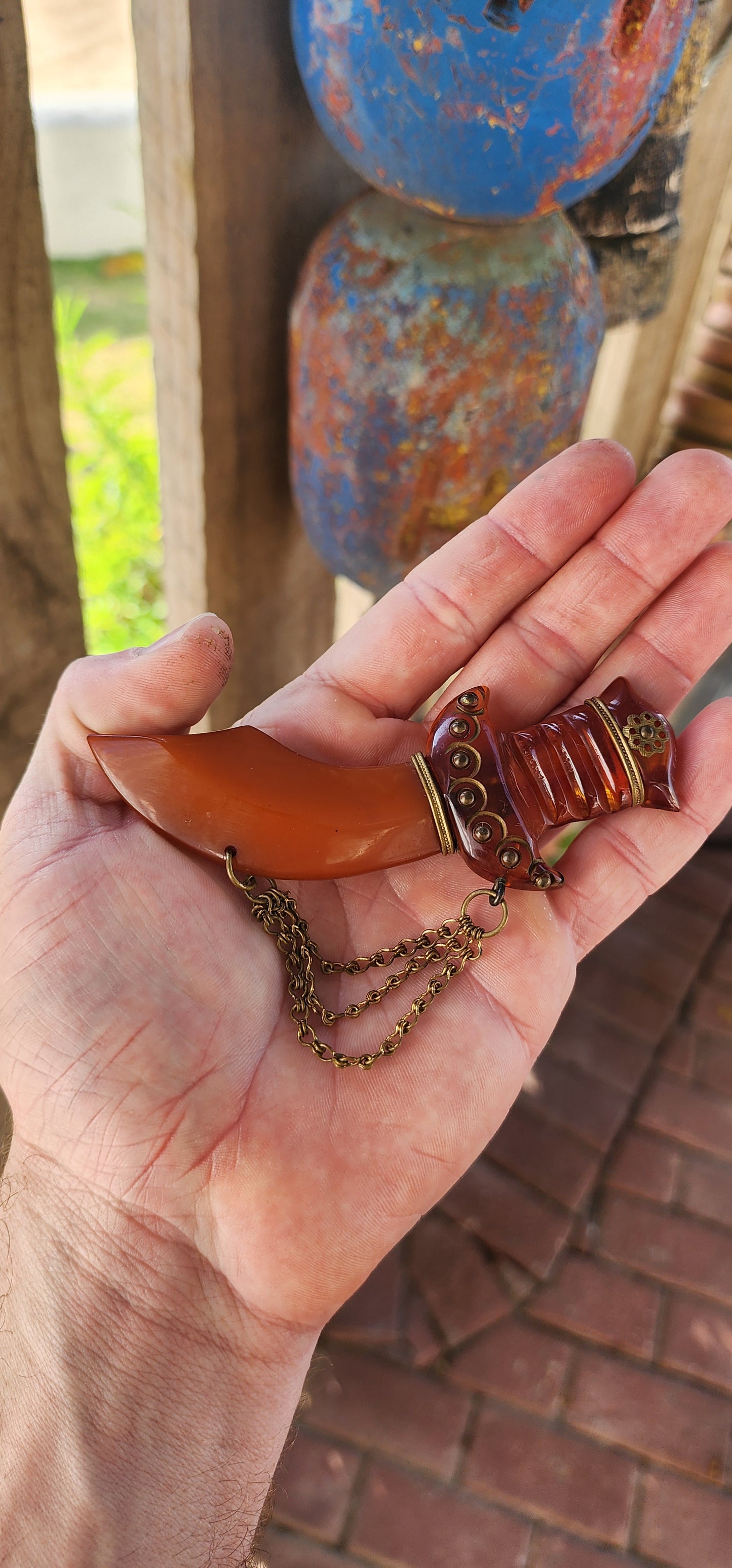 Marvelous and oversized Art Deco–era bakelite novelty brooch, exquisitely carved in the exotic form of a Persian dagger (khanjar)