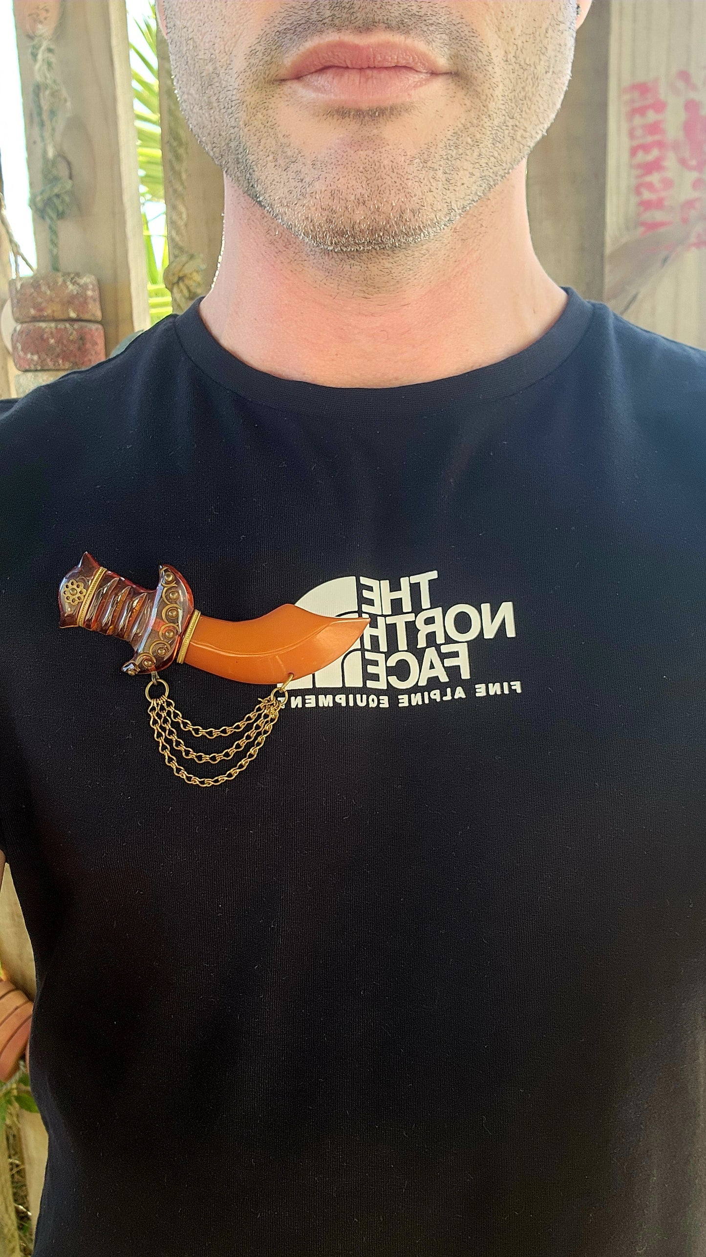 Marvelous and oversized Art Deco–era bakelite novelty brooch, exquisitely carved in the exotic form of a Persian dagger (khanjar)