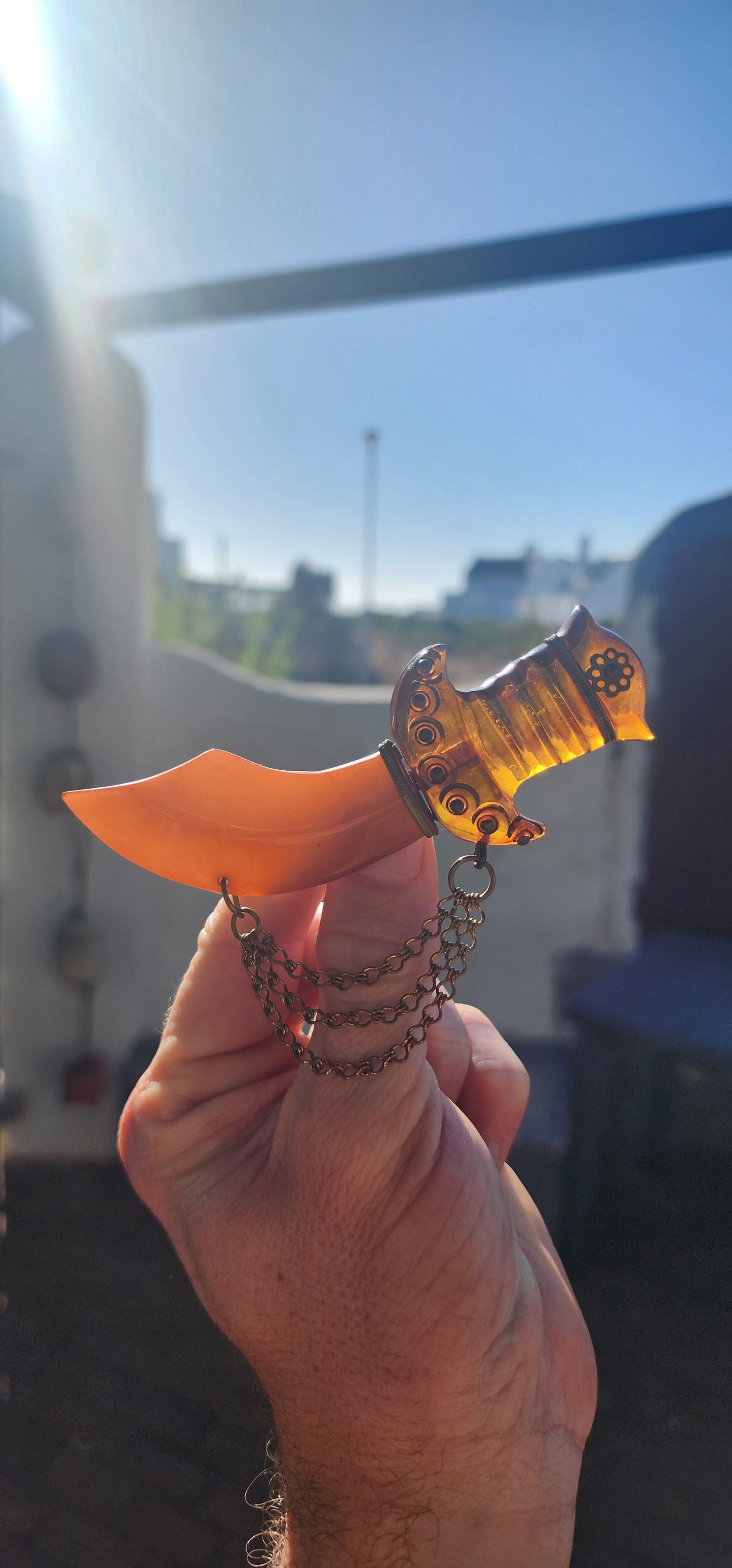 Marvelous and oversized Art Deco–era bakelite novelty brooch, exquisitely carved in the exotic form of a Persian dagger (khanjar)