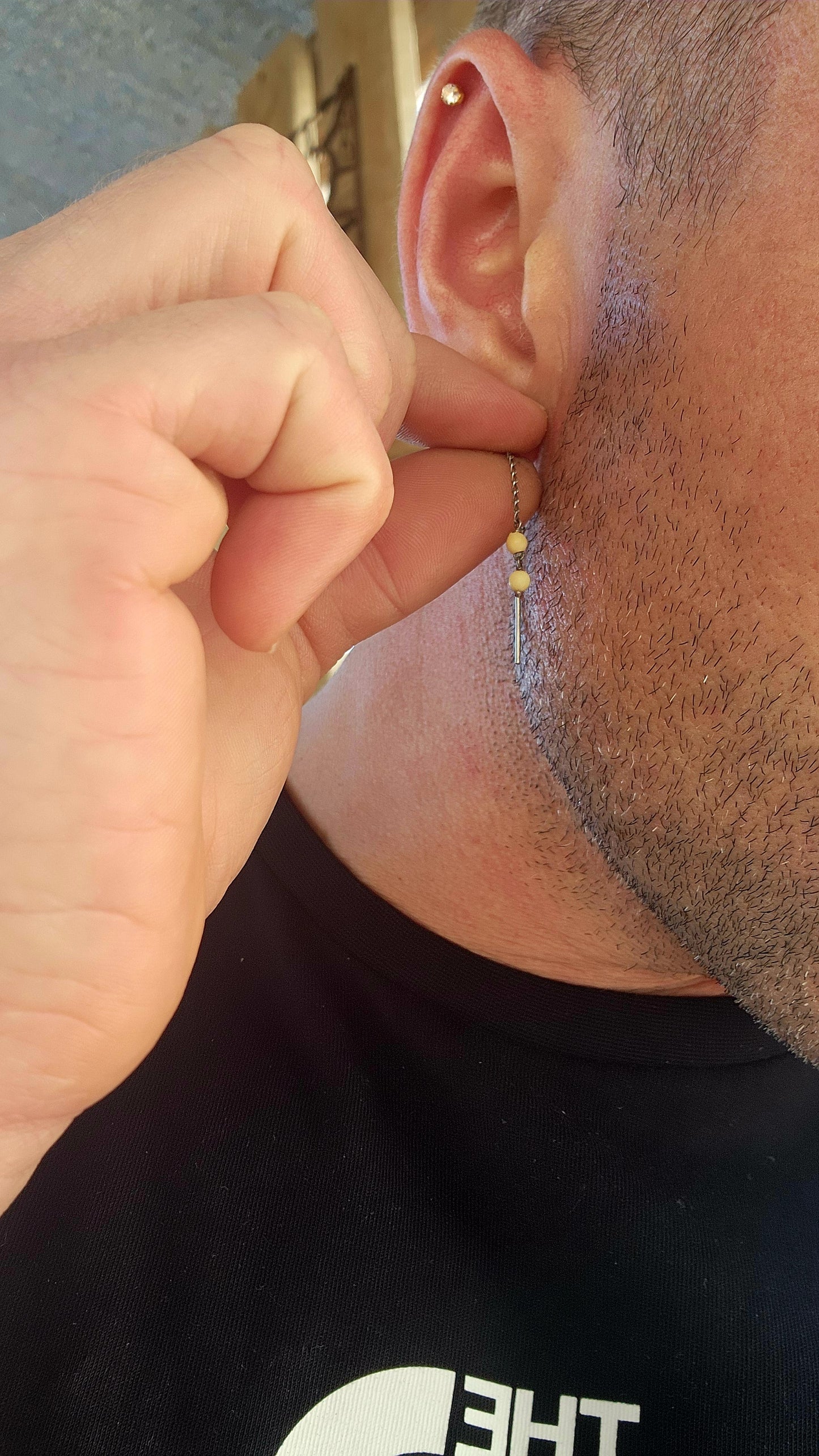 This playful pair of vintage sterling silver threader earrings offers a beautifully balanced mix of sleek metal and warm organic charm.
