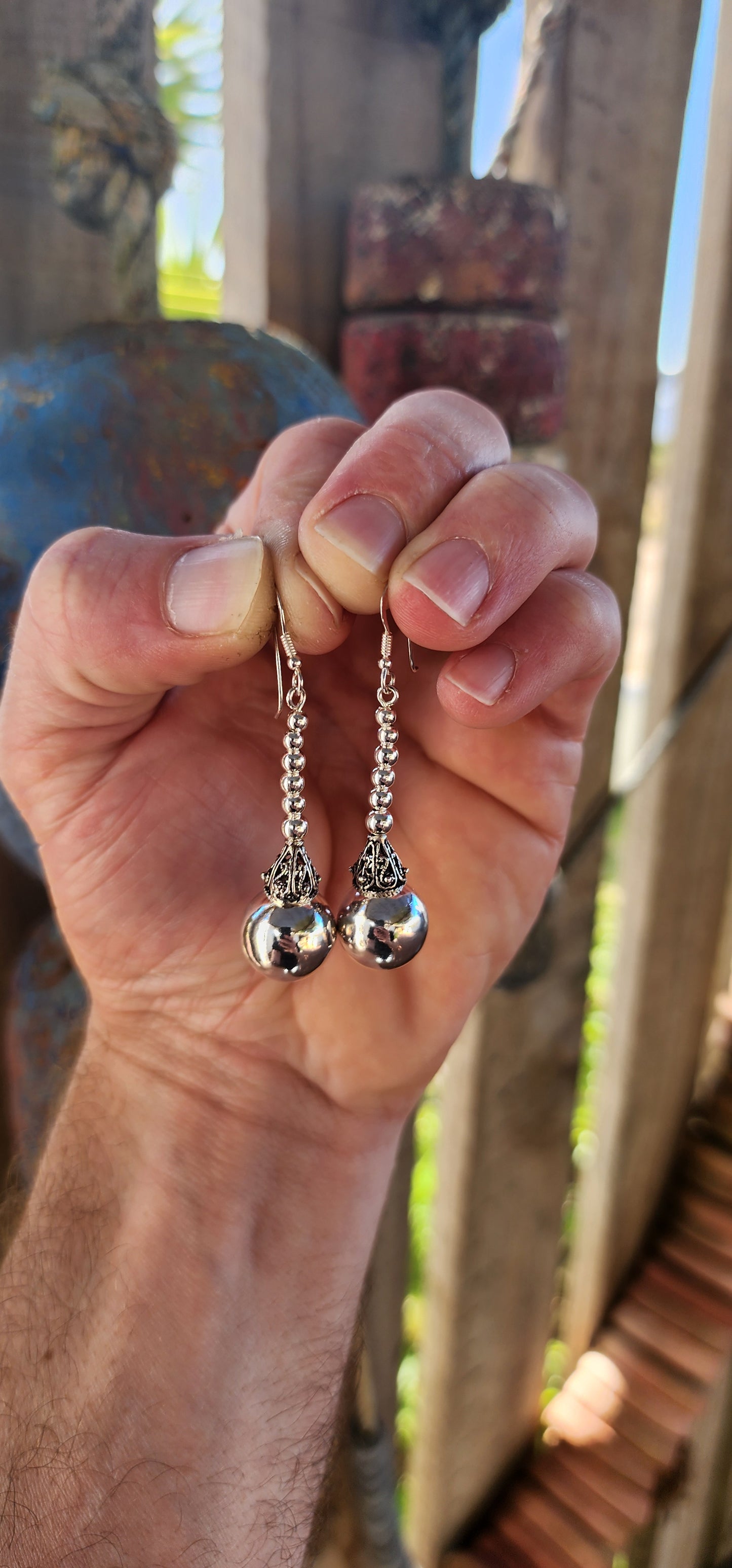 These magnificent sterling silver Balinese drop earrings are here to swing, shimmer, and steal the scene!