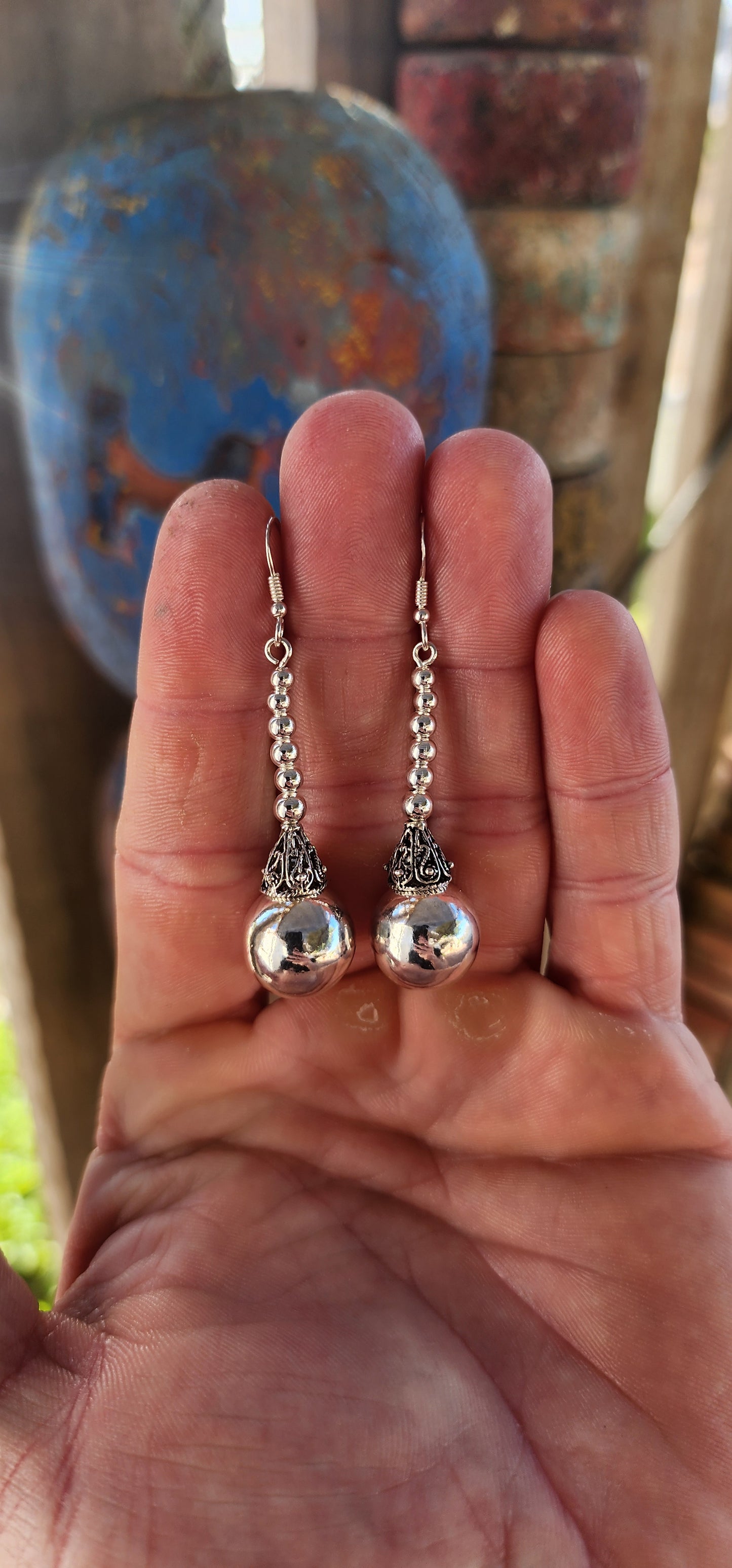 These magnificent sterling silver Balinese drop earrings are here to swing, shimmer, and steal the scene!