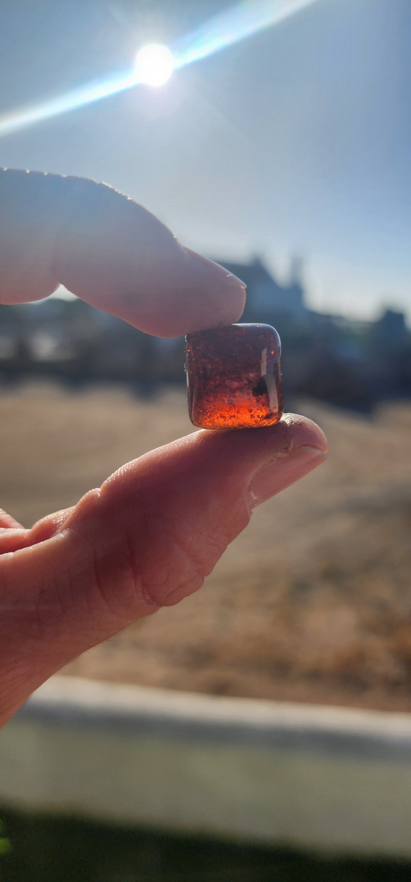 Behold this generous, dark burnt-orange tourmaline cabochon, masterfully shaped in the coveted sugar-loaf cut—a style treasured since ancient times for its softly domed peak and rounded geometric form.