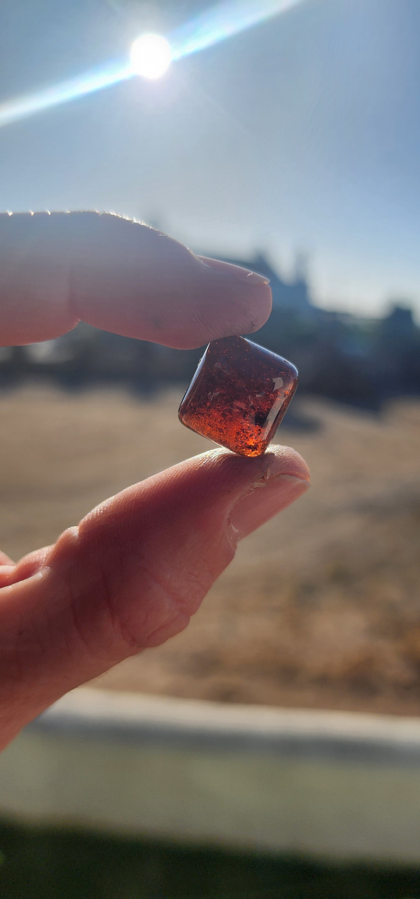 Behold this generous, dark burnt-orange tourmaline cabochon, masterfully shaped in the coveted sugar-loaf cut—a style treasured since ancient times for its softly domed peak and rounded geometric form.
